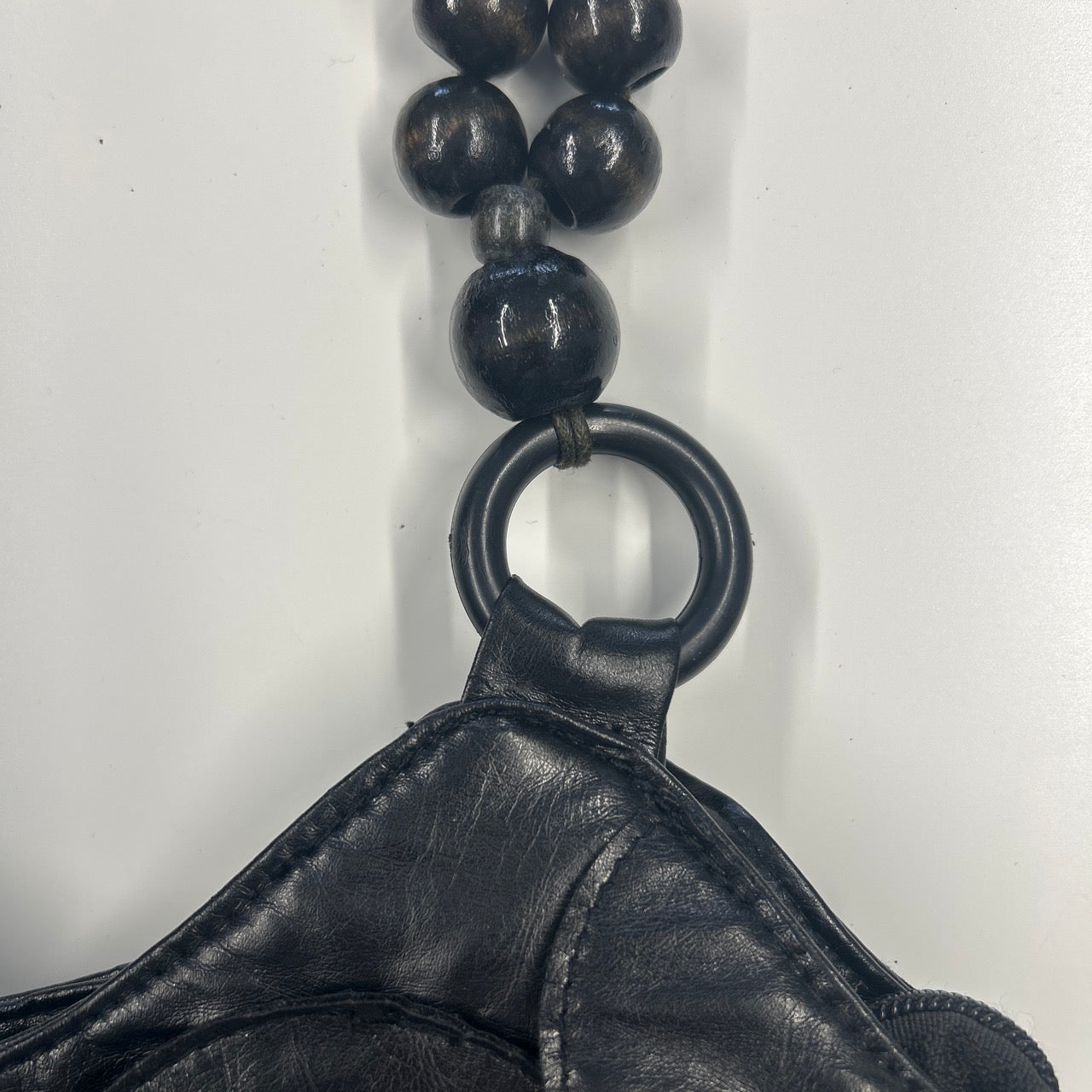 black faux leather disc beaded shoulder bag