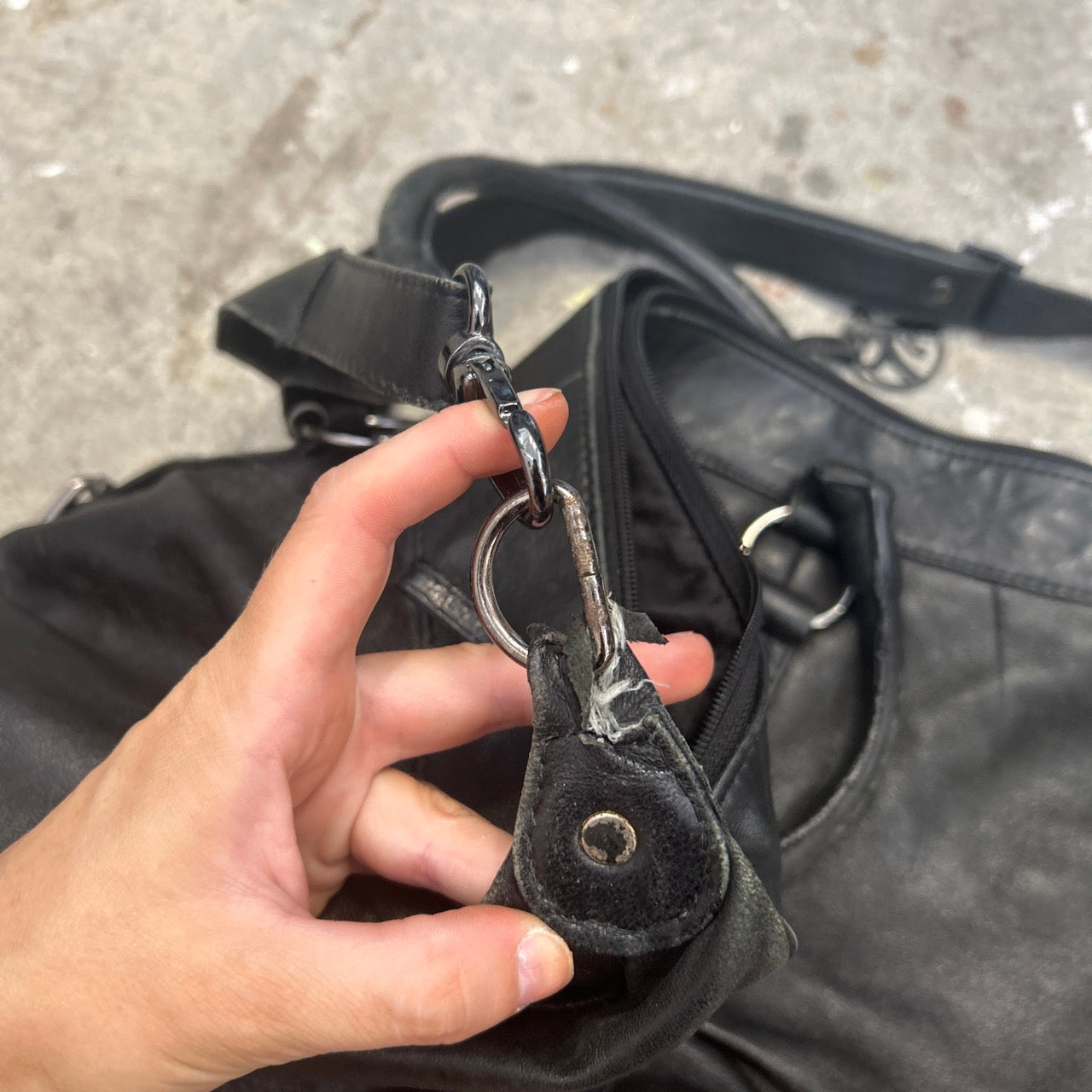 black genuine leather buckle luggage bag