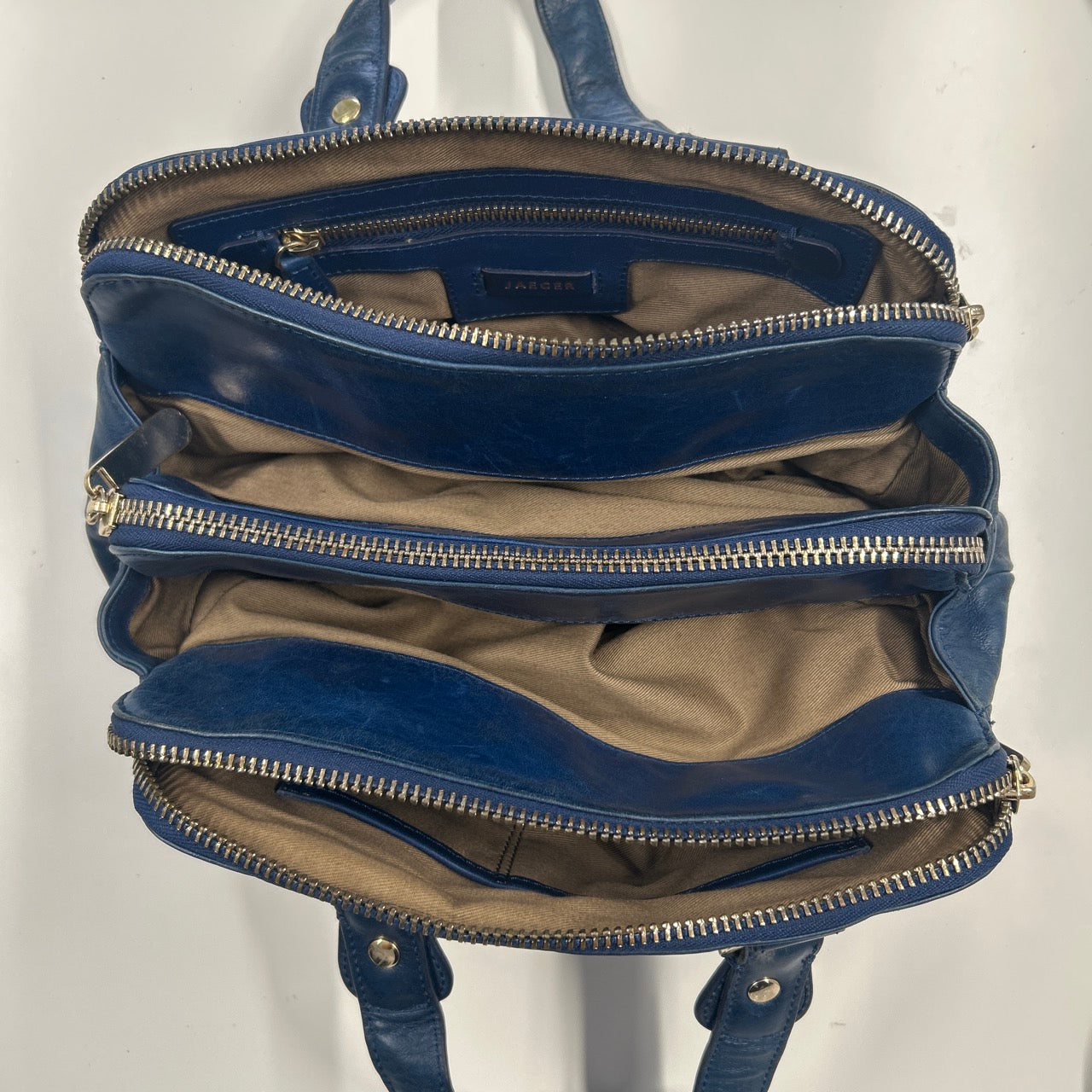 navy blue genuine leather triple compartment hand bag