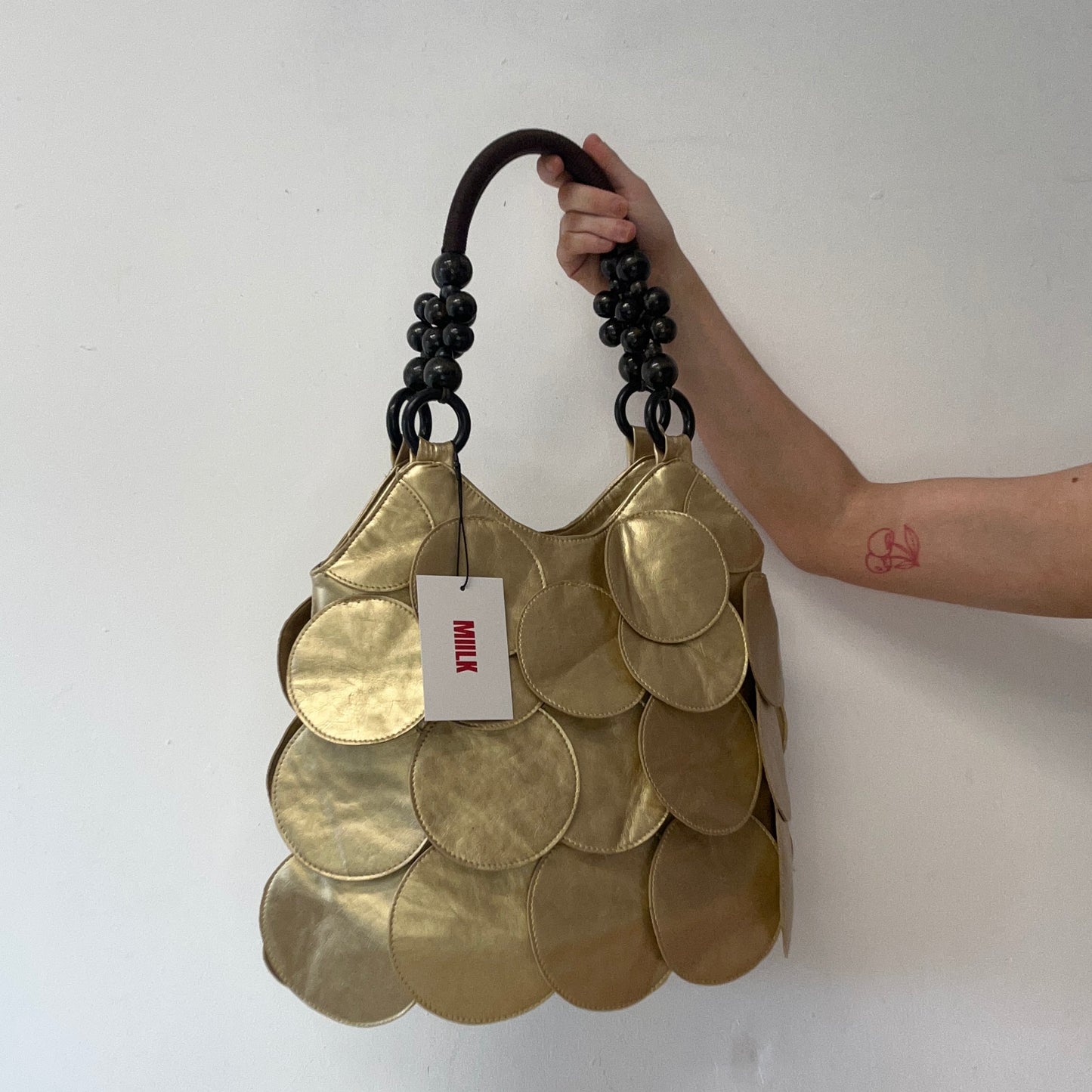 gold faux leather disc beaded shoulder bag