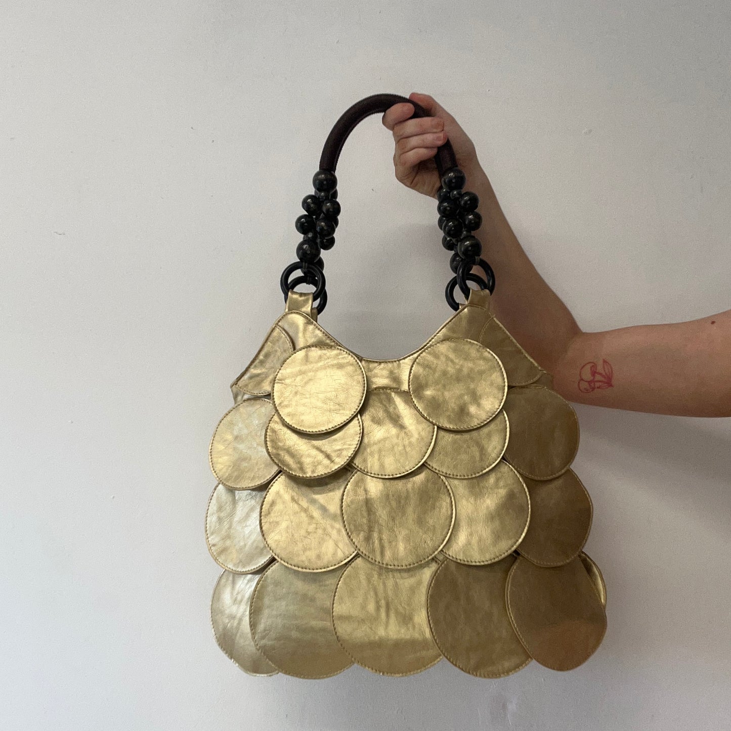 gold faux leather disc beaded shoulder bag