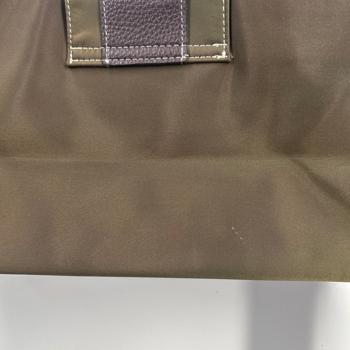 khaki canvas and brown faux leather buckle shoulder bag