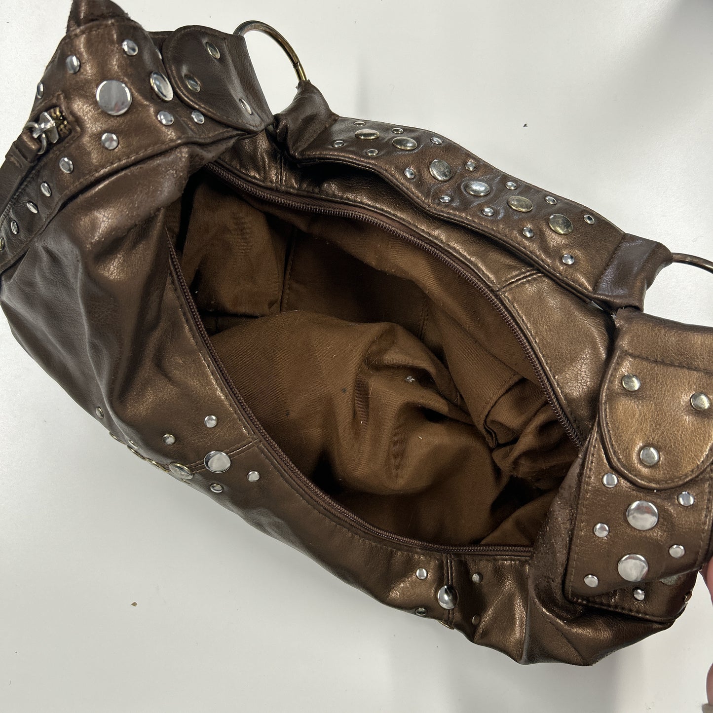 brown studded faux leather half crescent shoulder bag