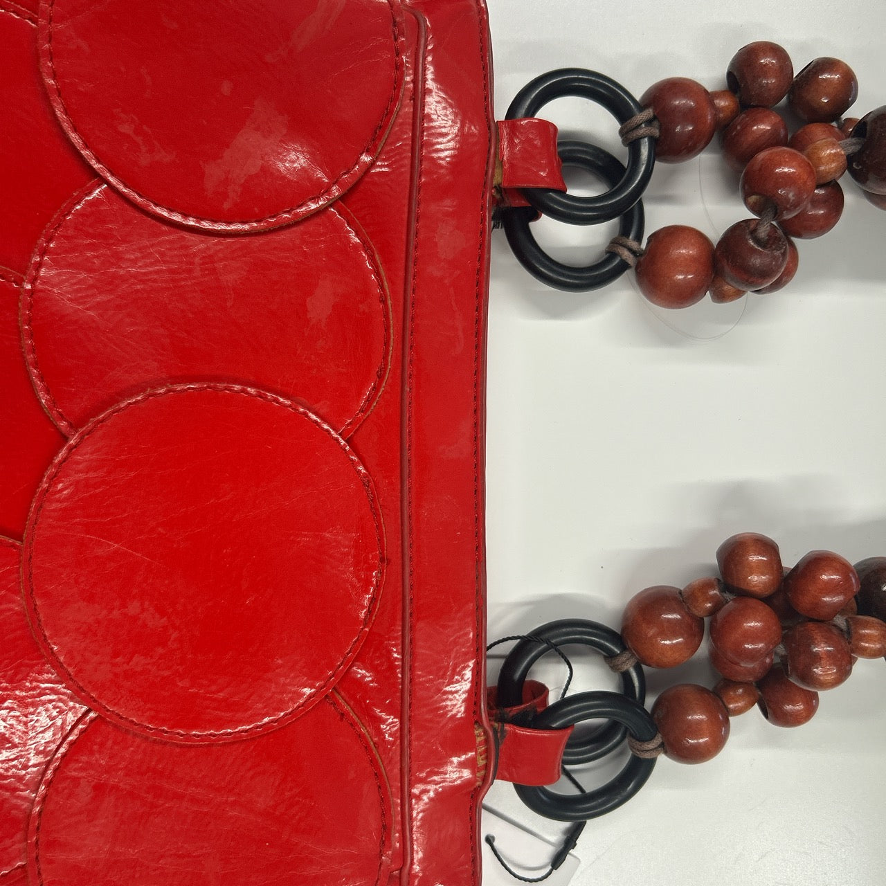 red faux leather disc beaded shoulder bag