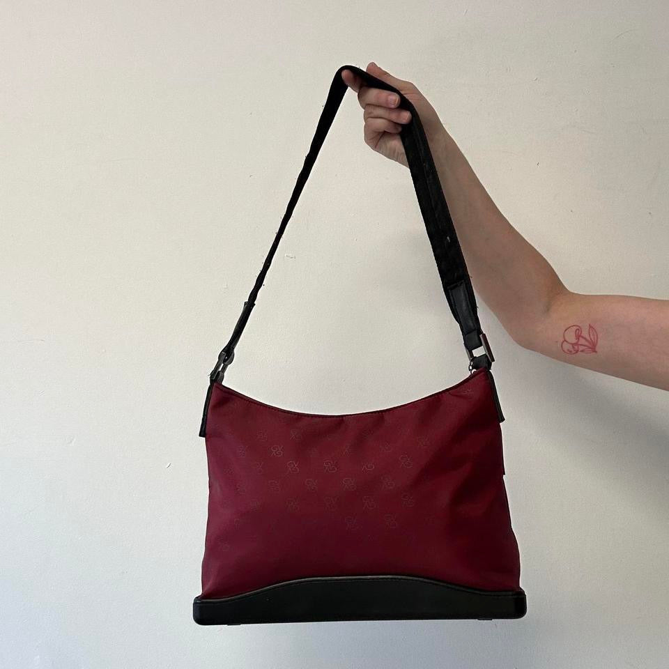 red and black canvas shoulder bag