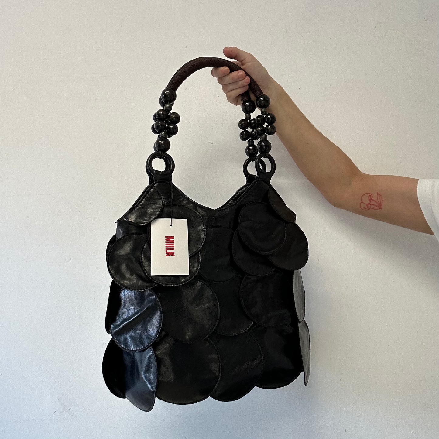 black faux leather disc beaded shoulder bag