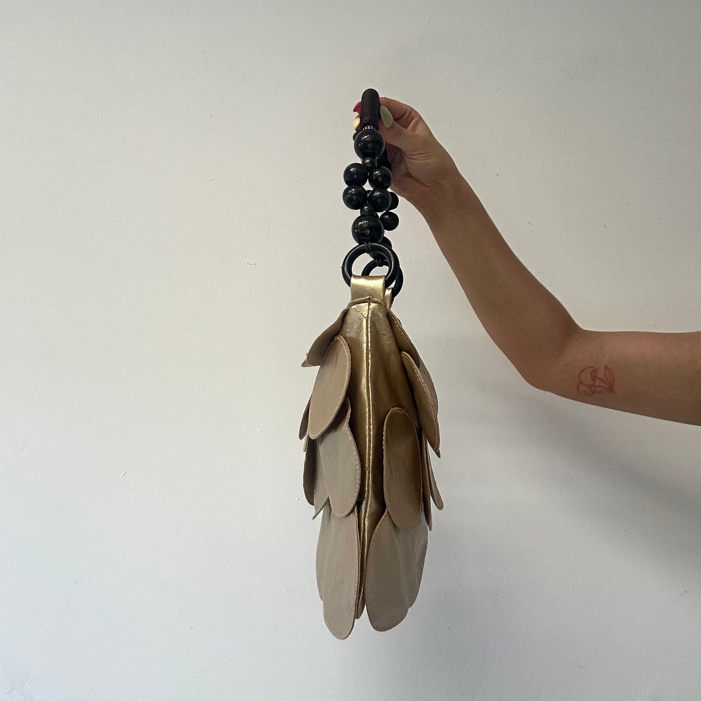 gold faux leather disc beaded shoulder bag