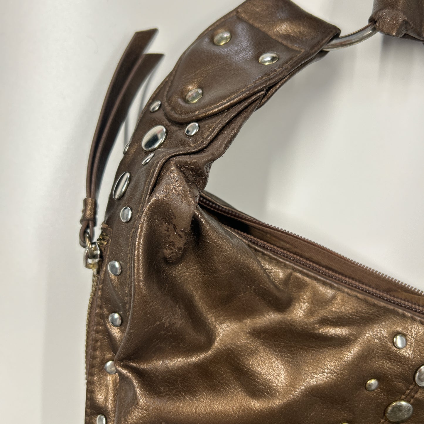 brown studded faux leather half crescent shoulder bag