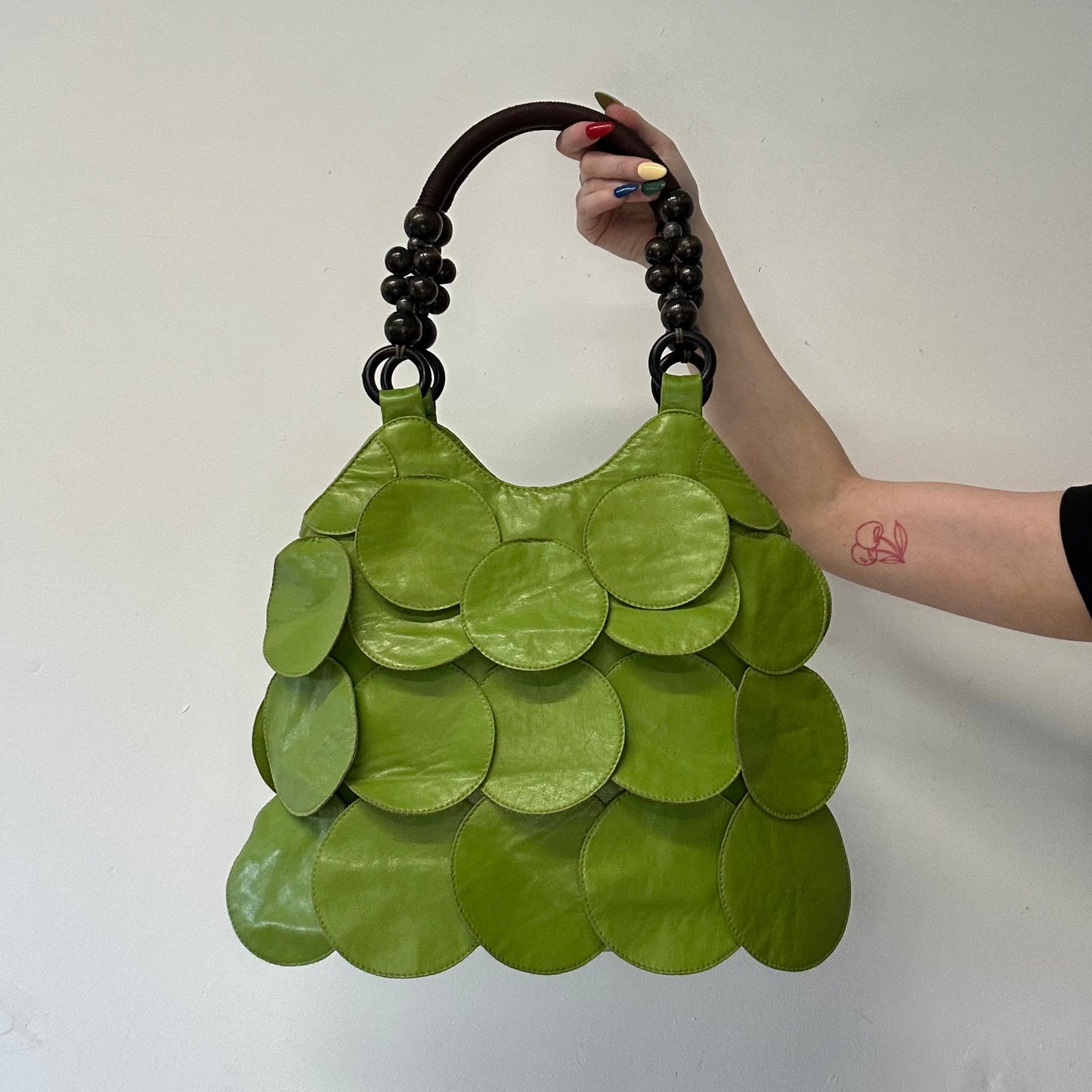 green faux leather disc beaded shoulder bag
