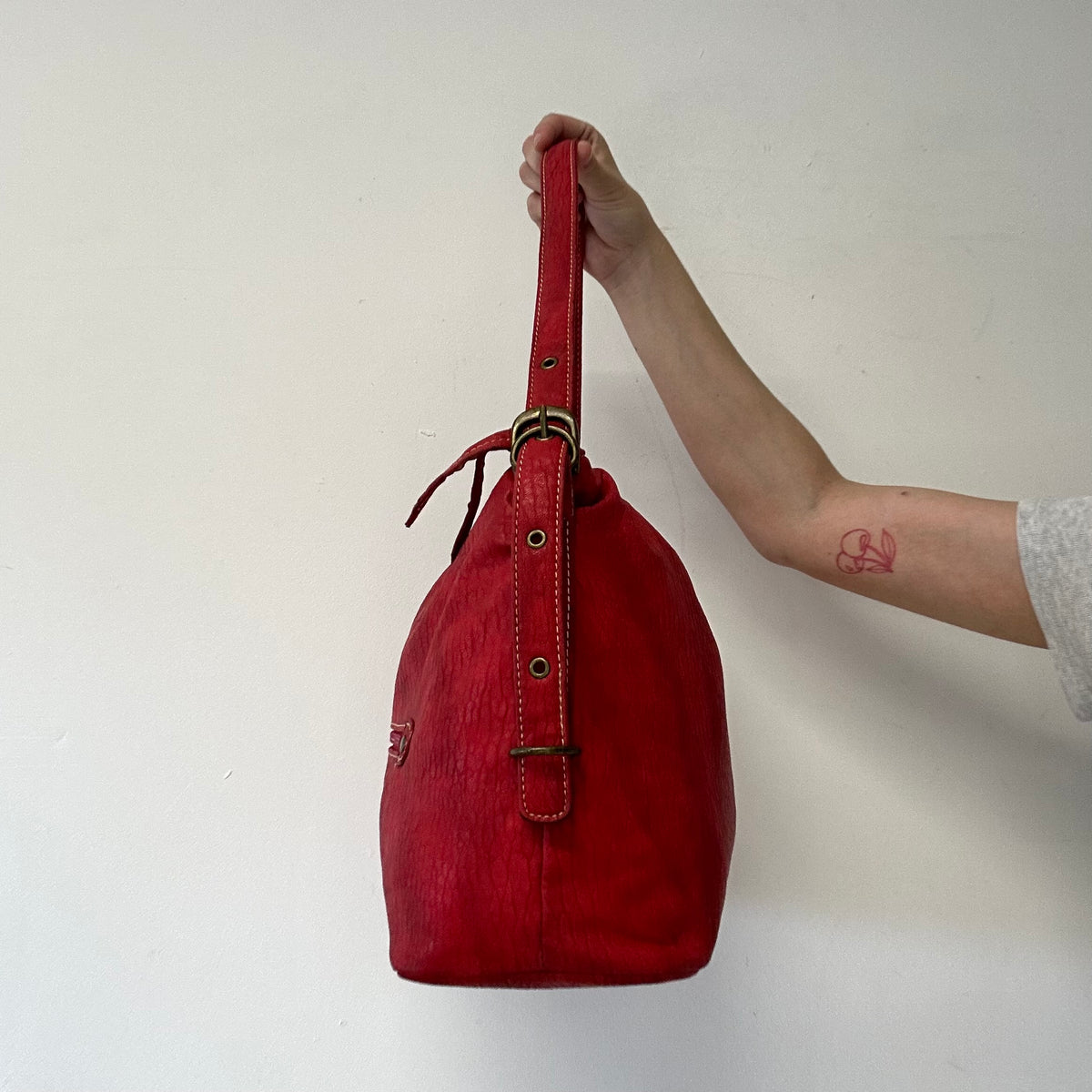 red faux leather shoulder bag