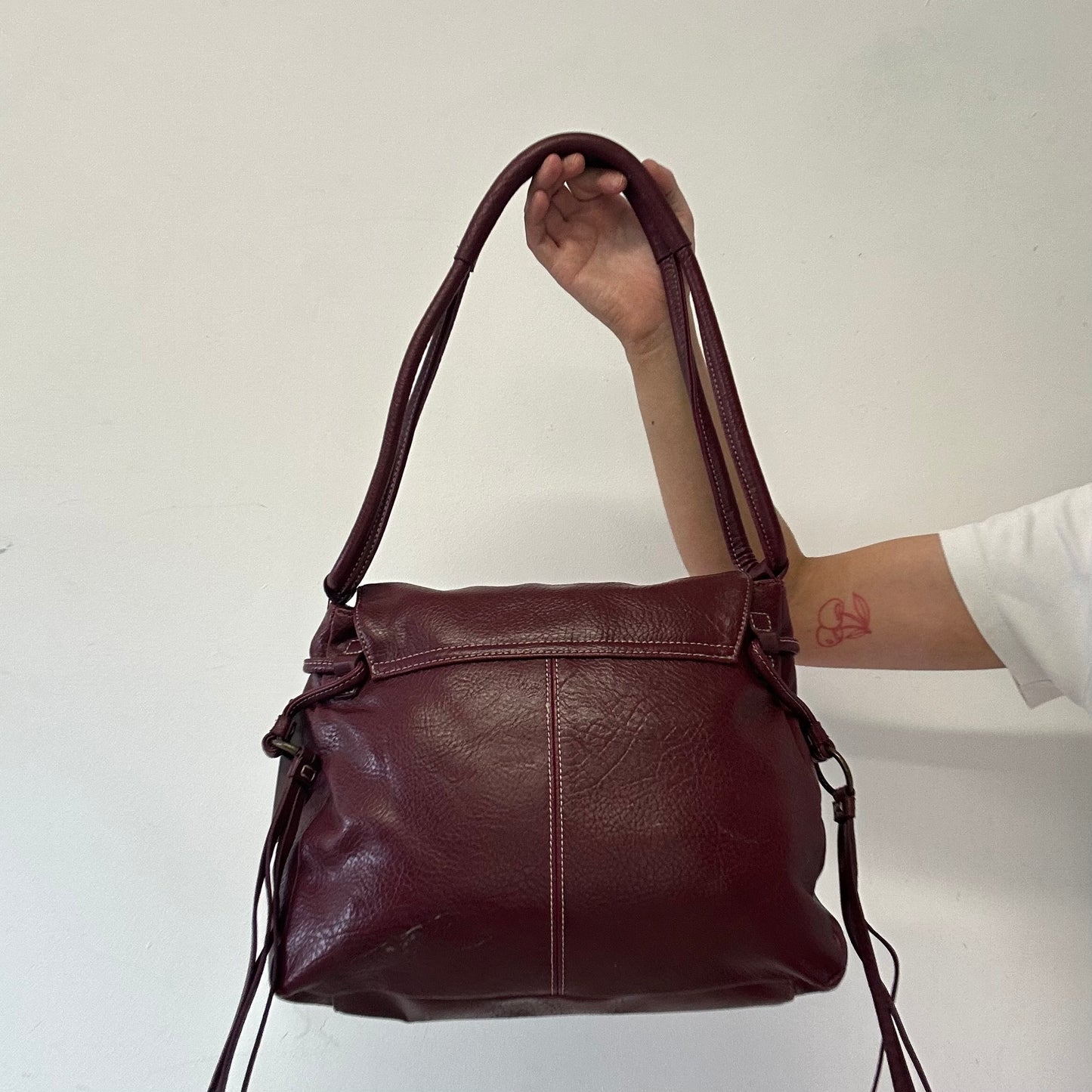 dark red faux leather western buckle shoulder bag