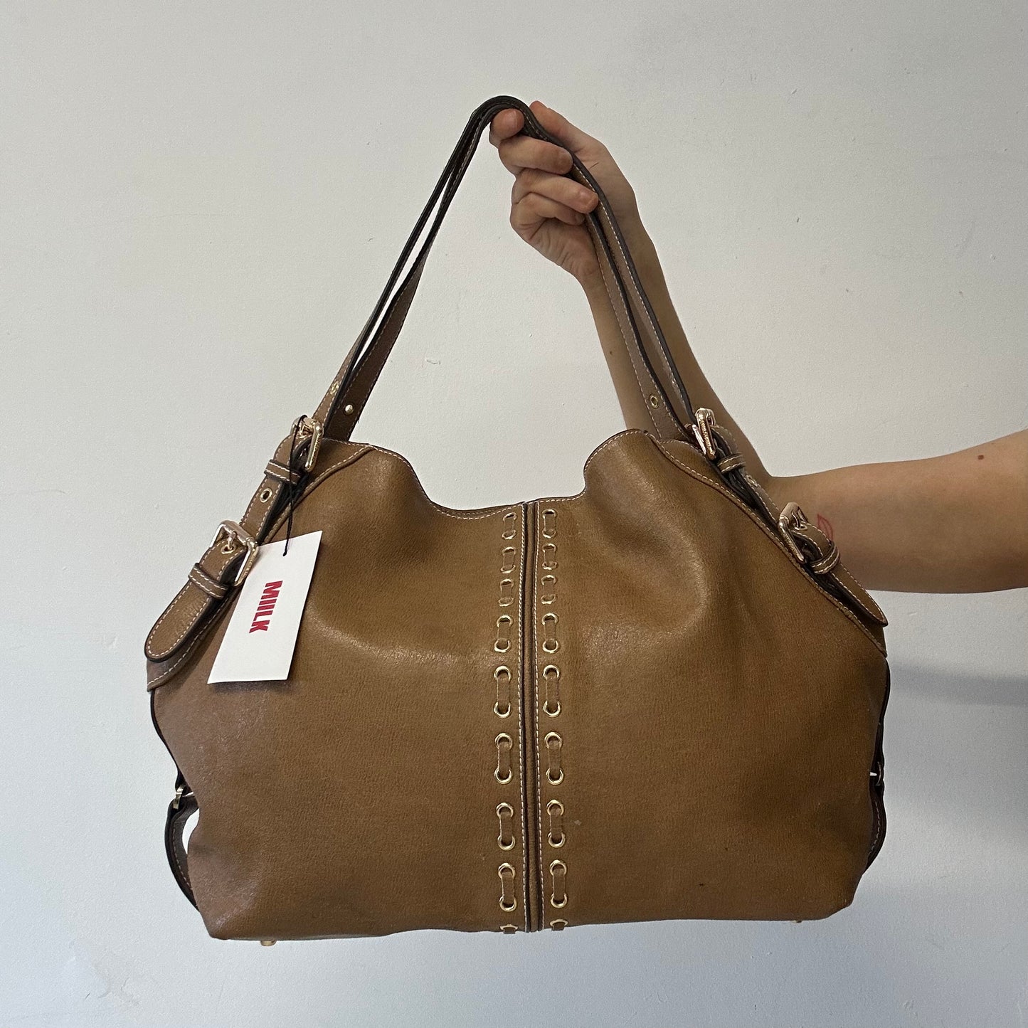 brown eyelet faux leather shoulder bag