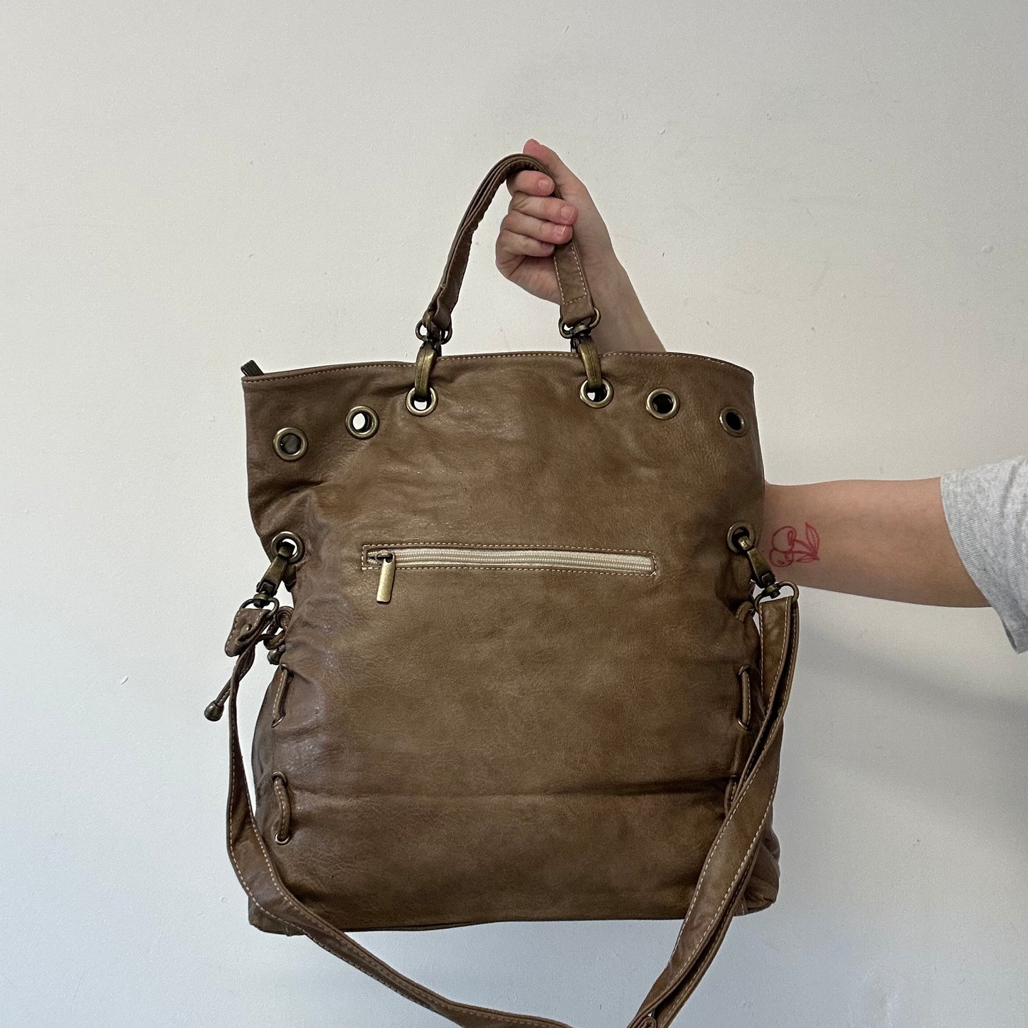 brown eyelet ruched sides faux leather shoulder bag
