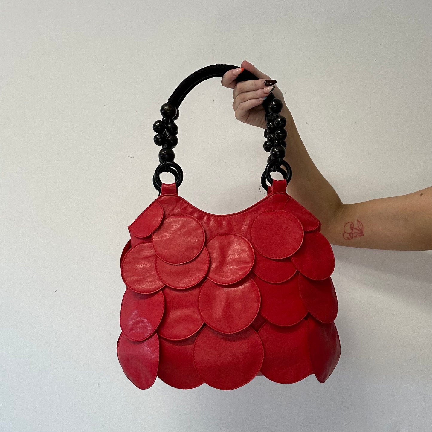 red faux leather disc beaded shoulder bag