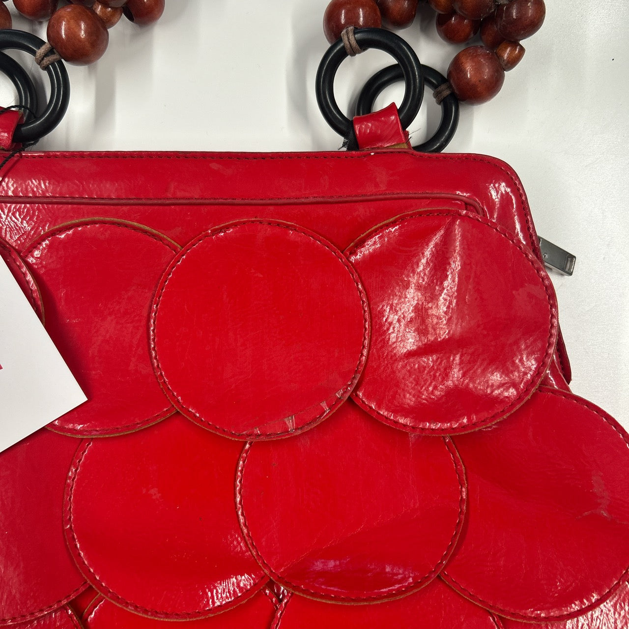 red faux leather disc beaded shoulder bag