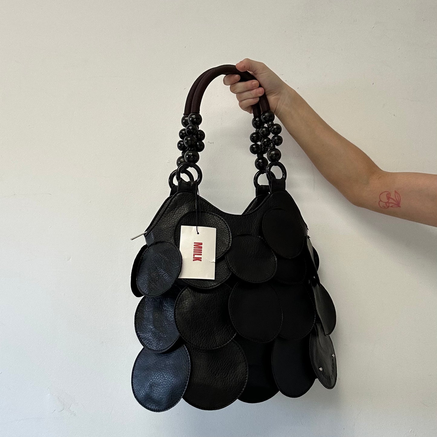 black faux leather disc beaded shoulder bag