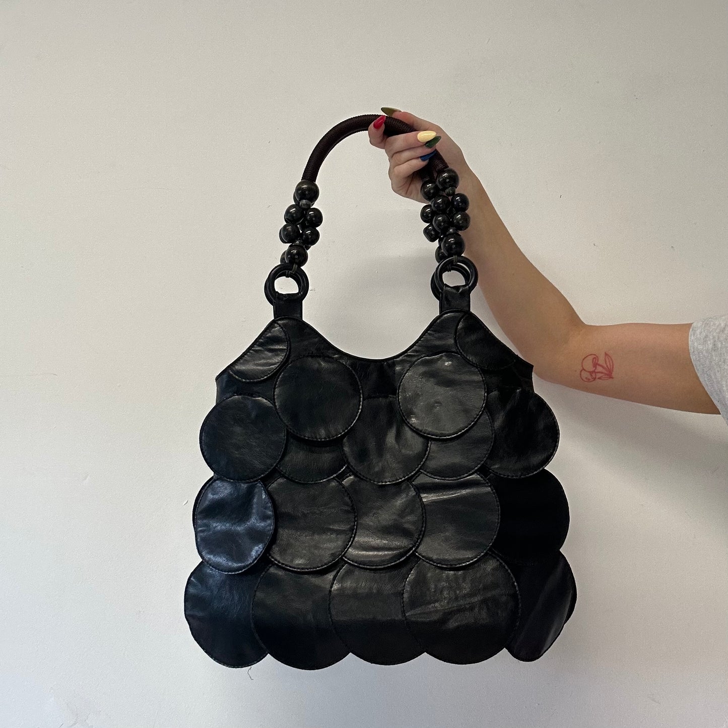black faux leather disc beaded shoulder bag