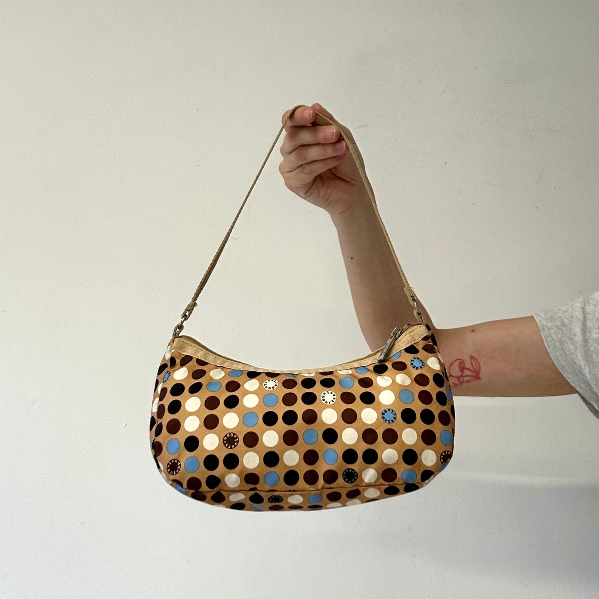 tanned blue polka dot canvas mini shoulder bag