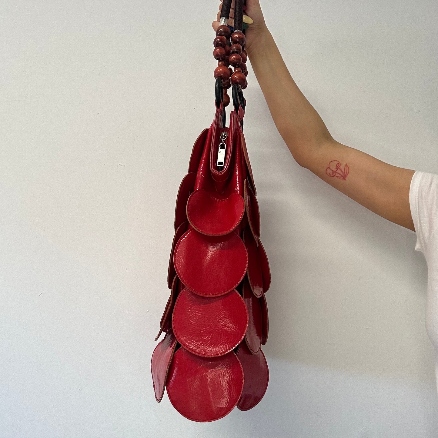 red faux leather disc beaded shoulder bag