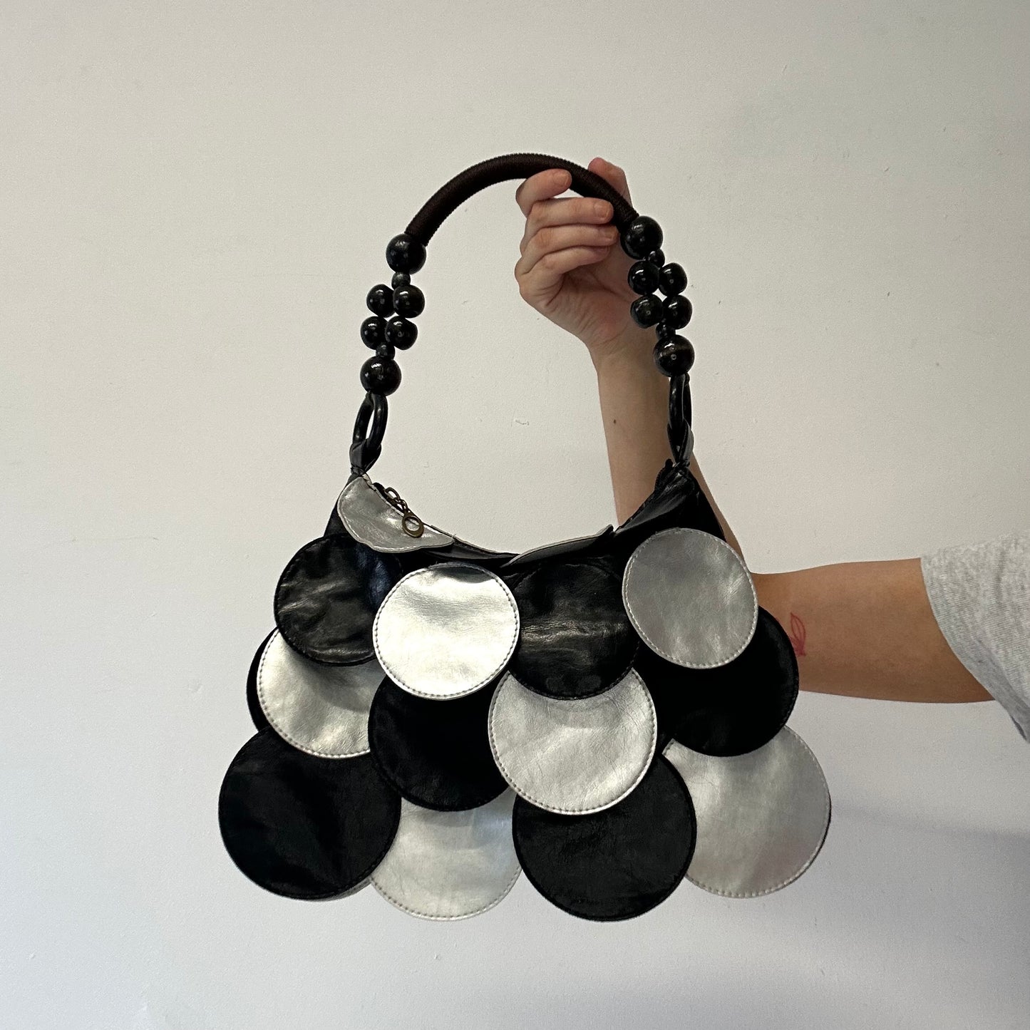 black and silver faux leather disc beaded shoulder bag very