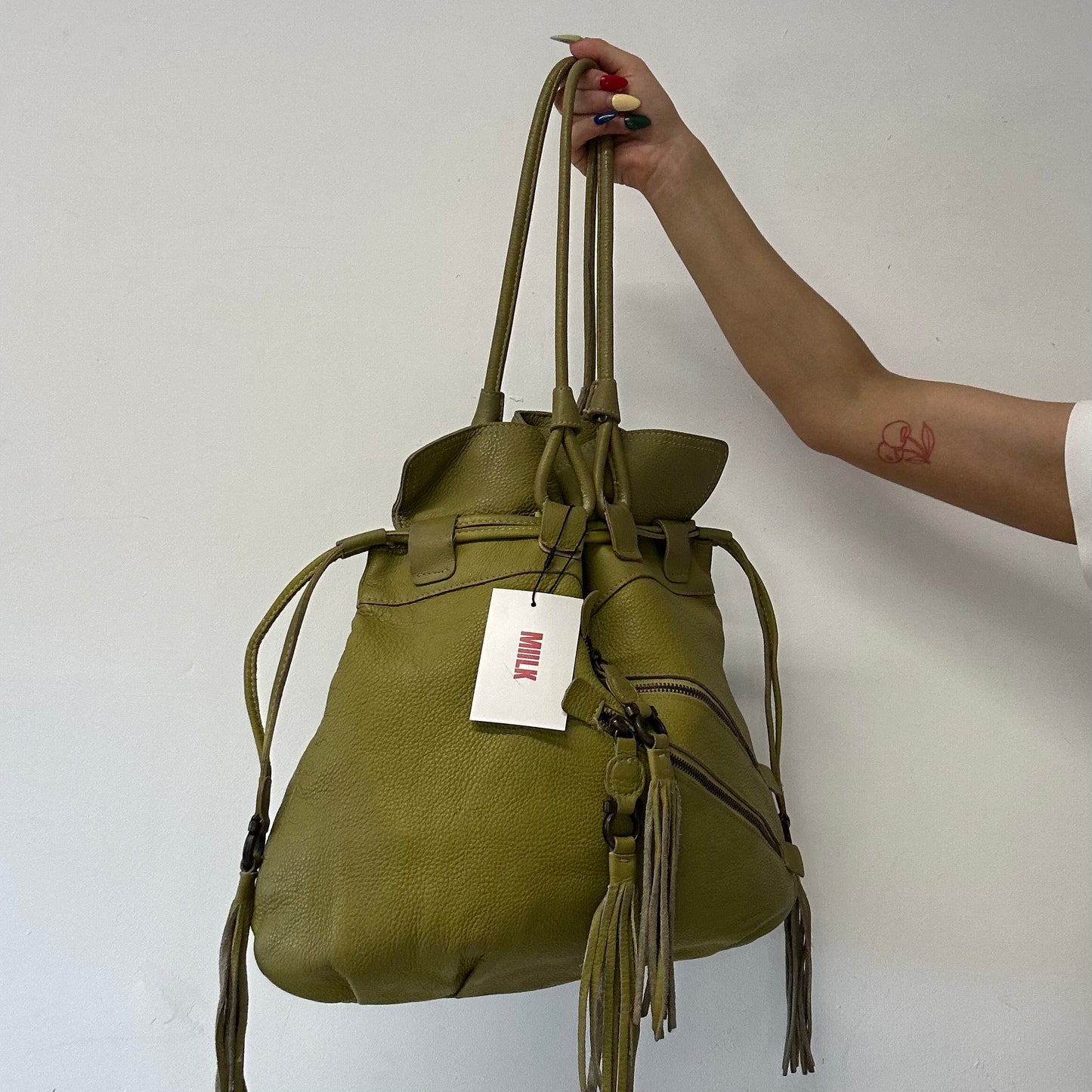 green leather double zip drawstring tote bag