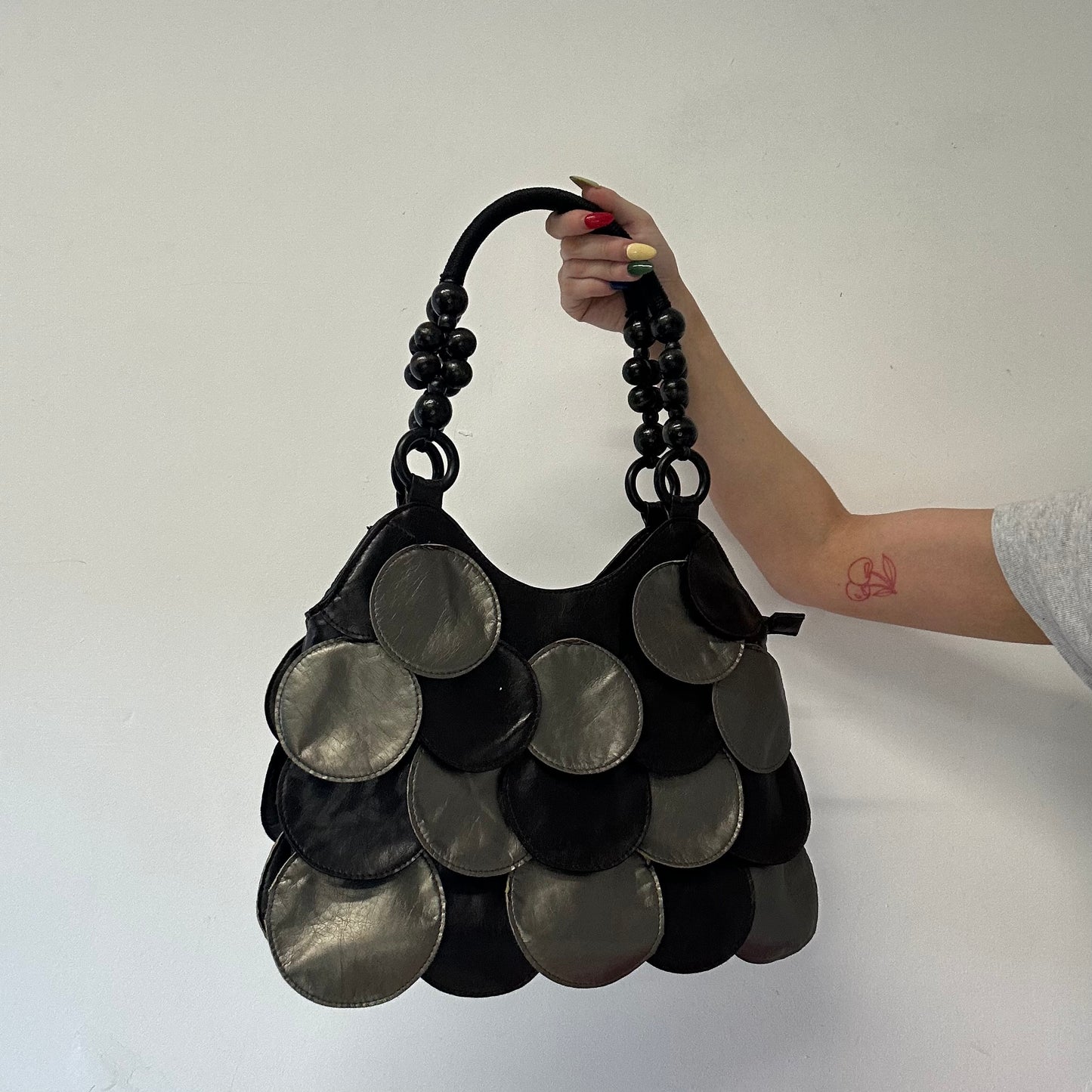 silver and black faux leather disc beaded shoulder bag