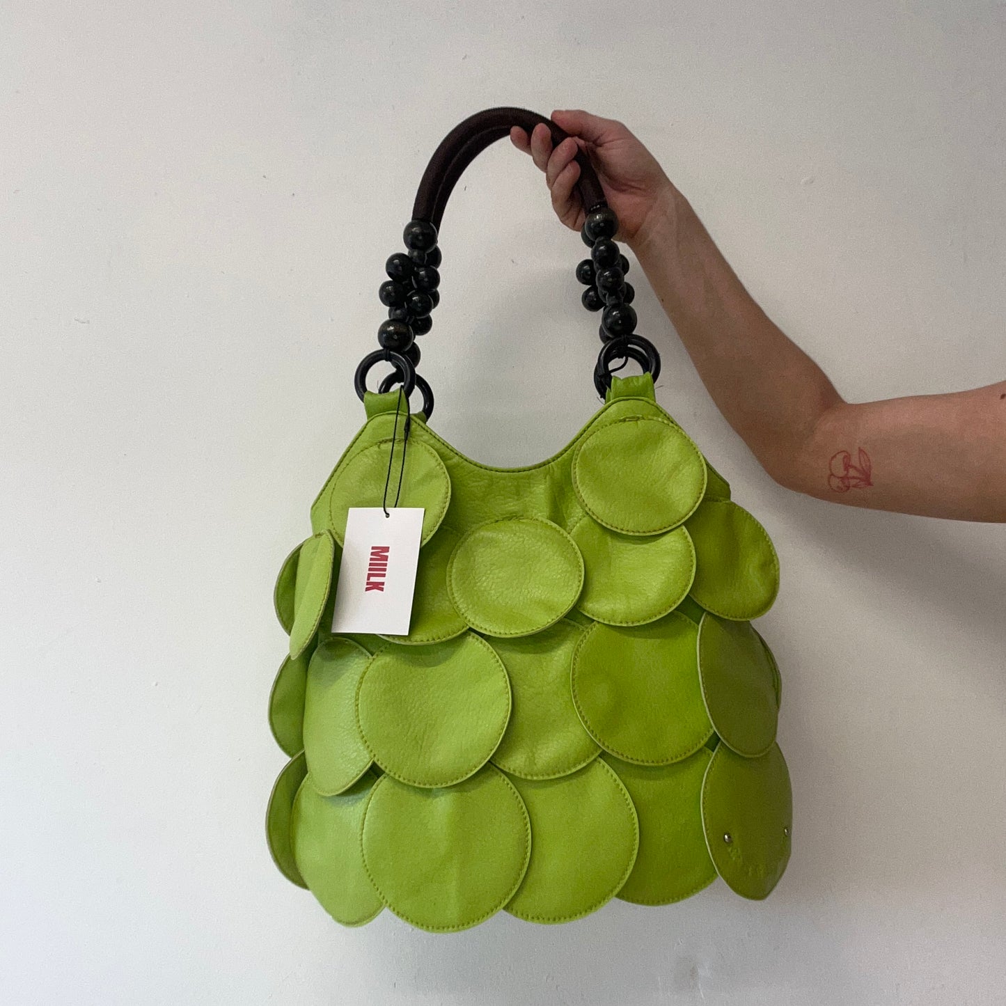 green faux leather disc beaded shoulder bag