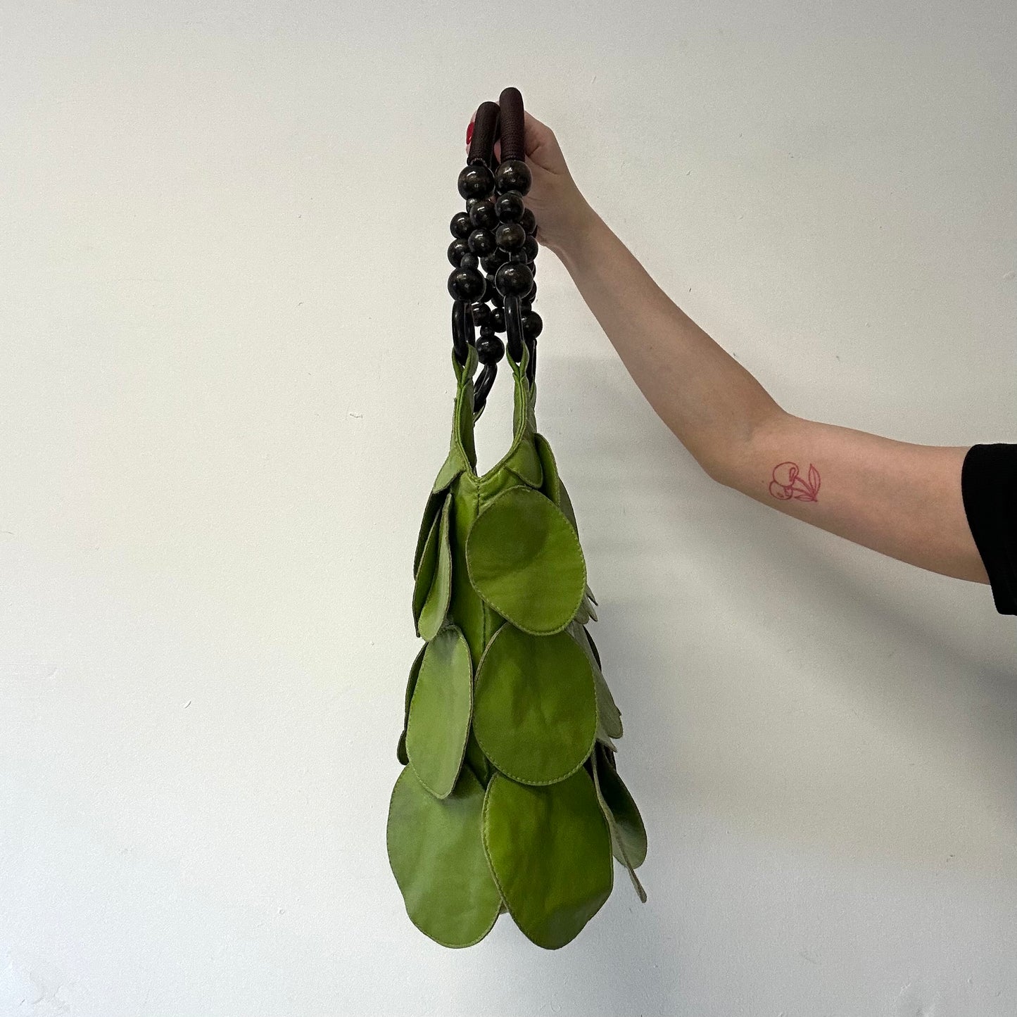 green faux leather disc beaded shoulder bag