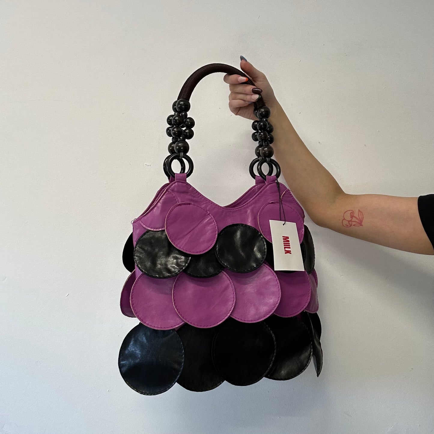pink and black faux leather disc beaded shoulder bag