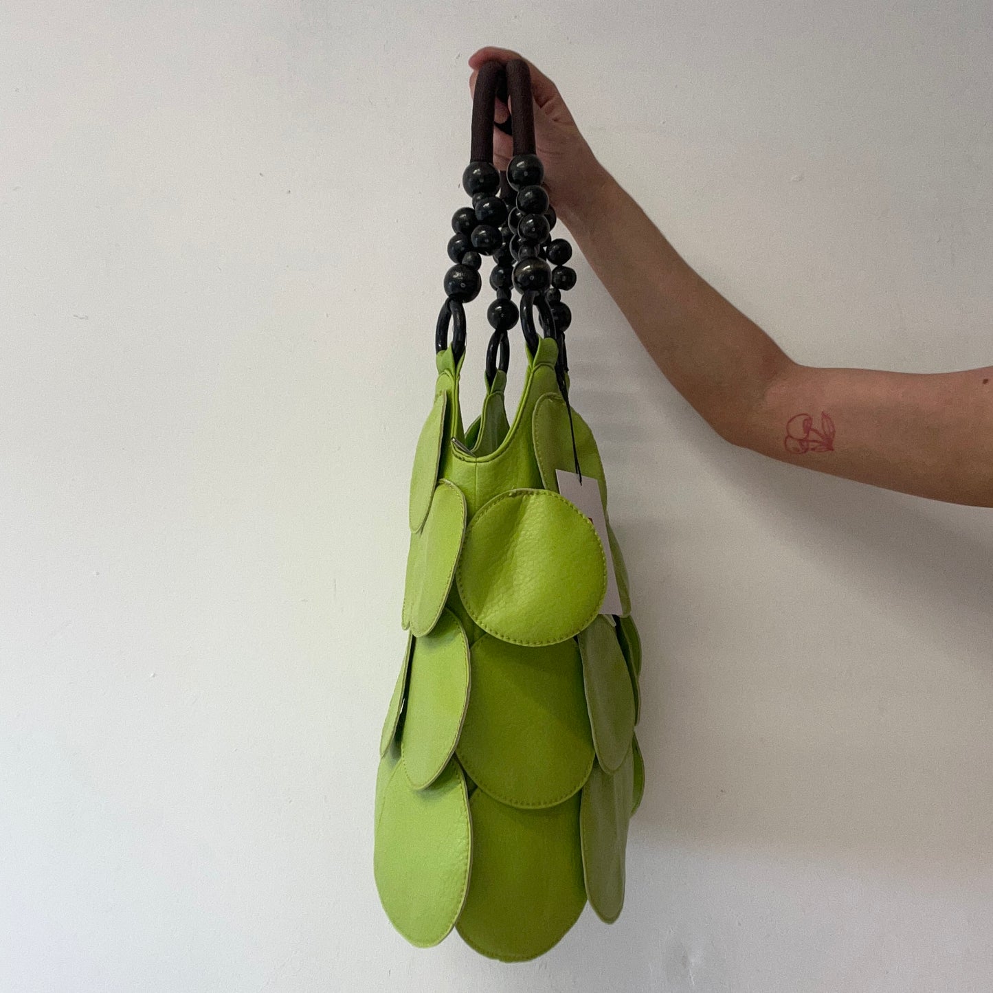 green faux leather disc beaded shoulder bag