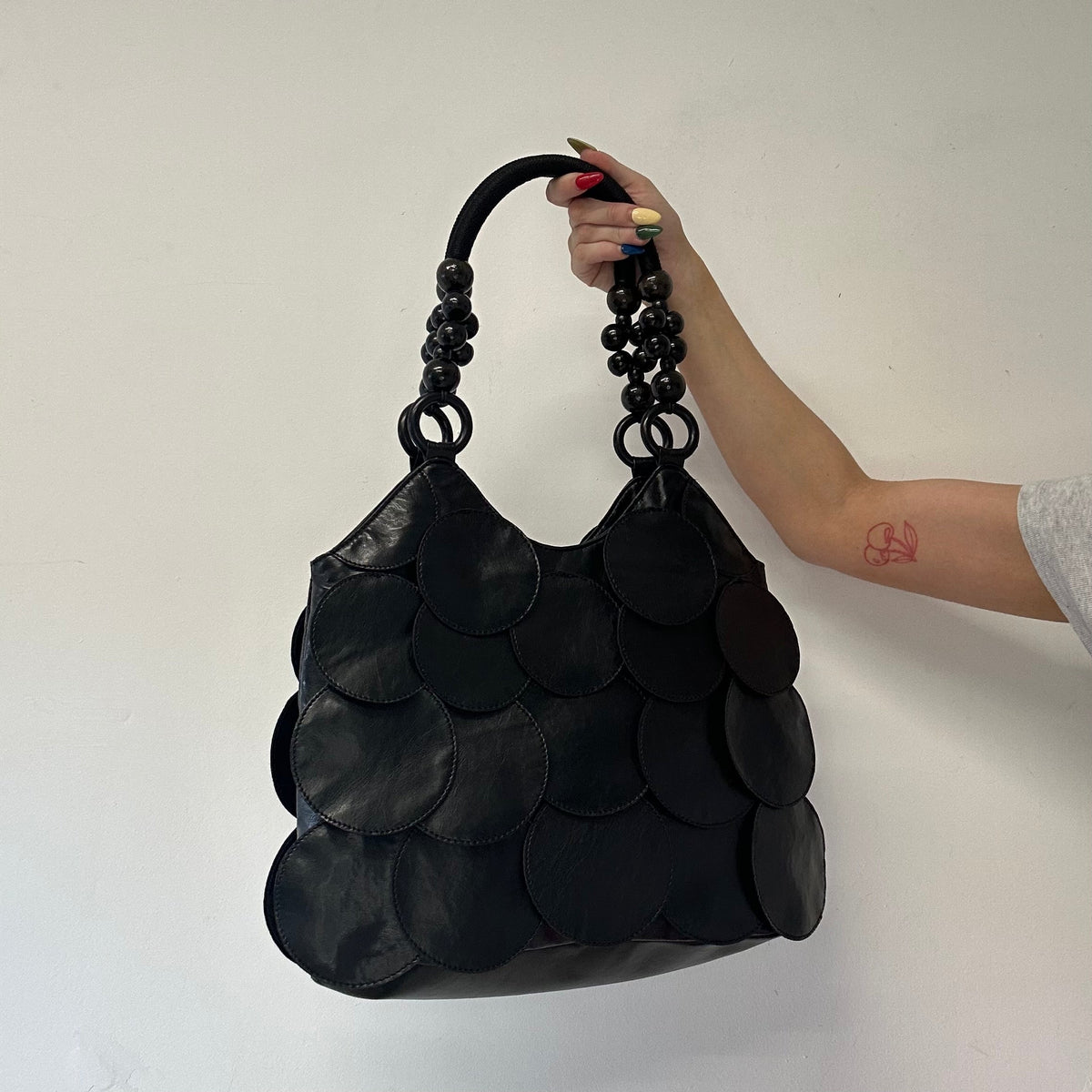 black faux leather disc beaded shoulder bag