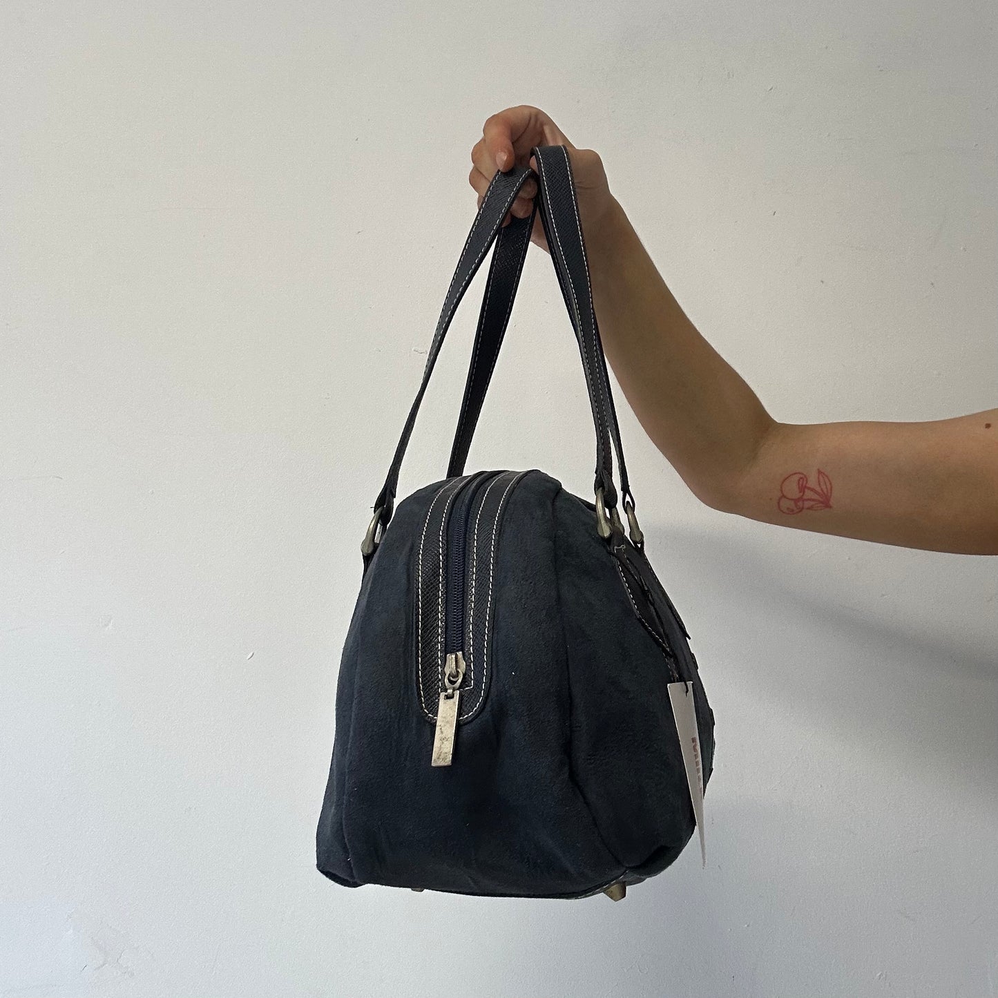 navy eyelet bowler shoulder bag