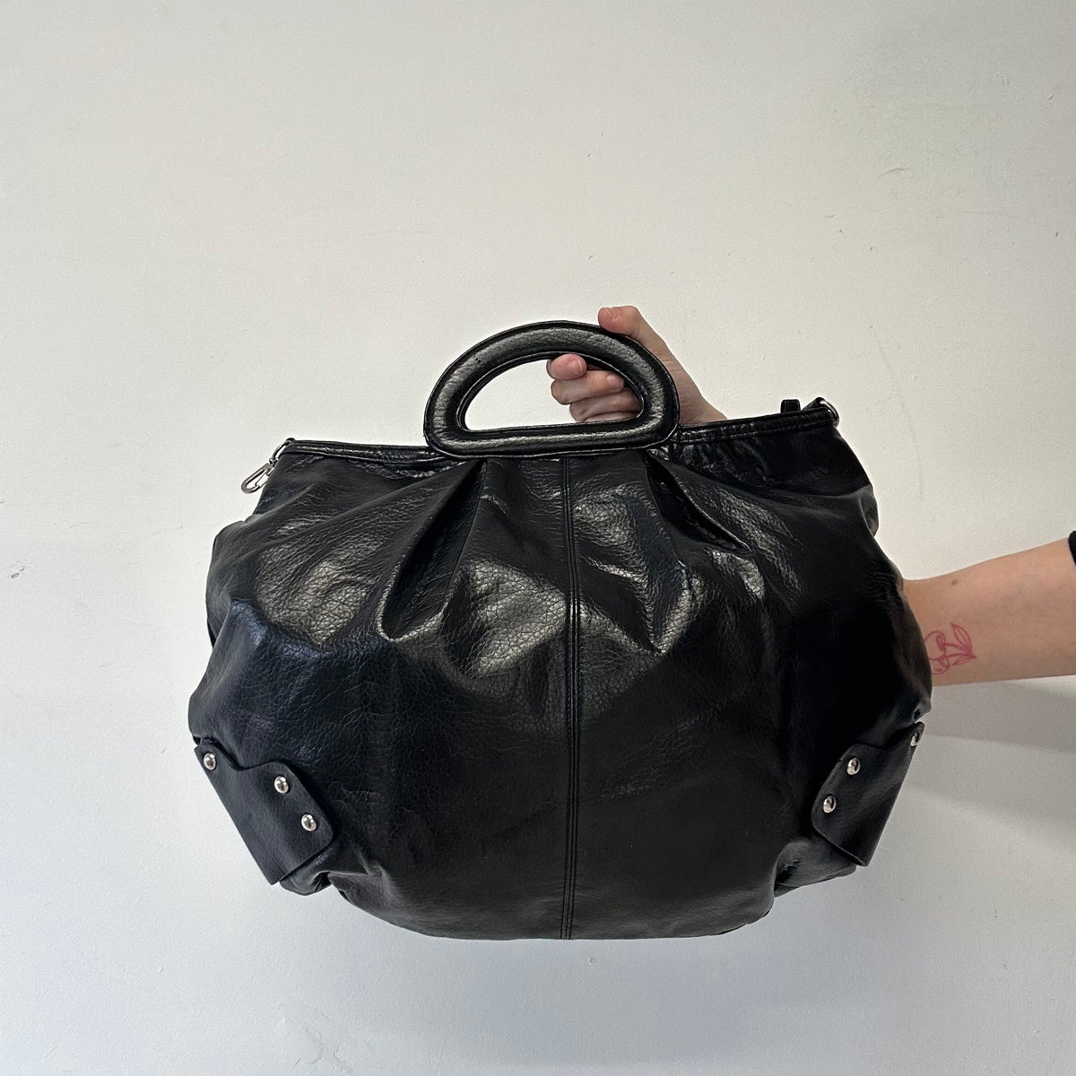 black faux leather keychain hand bag