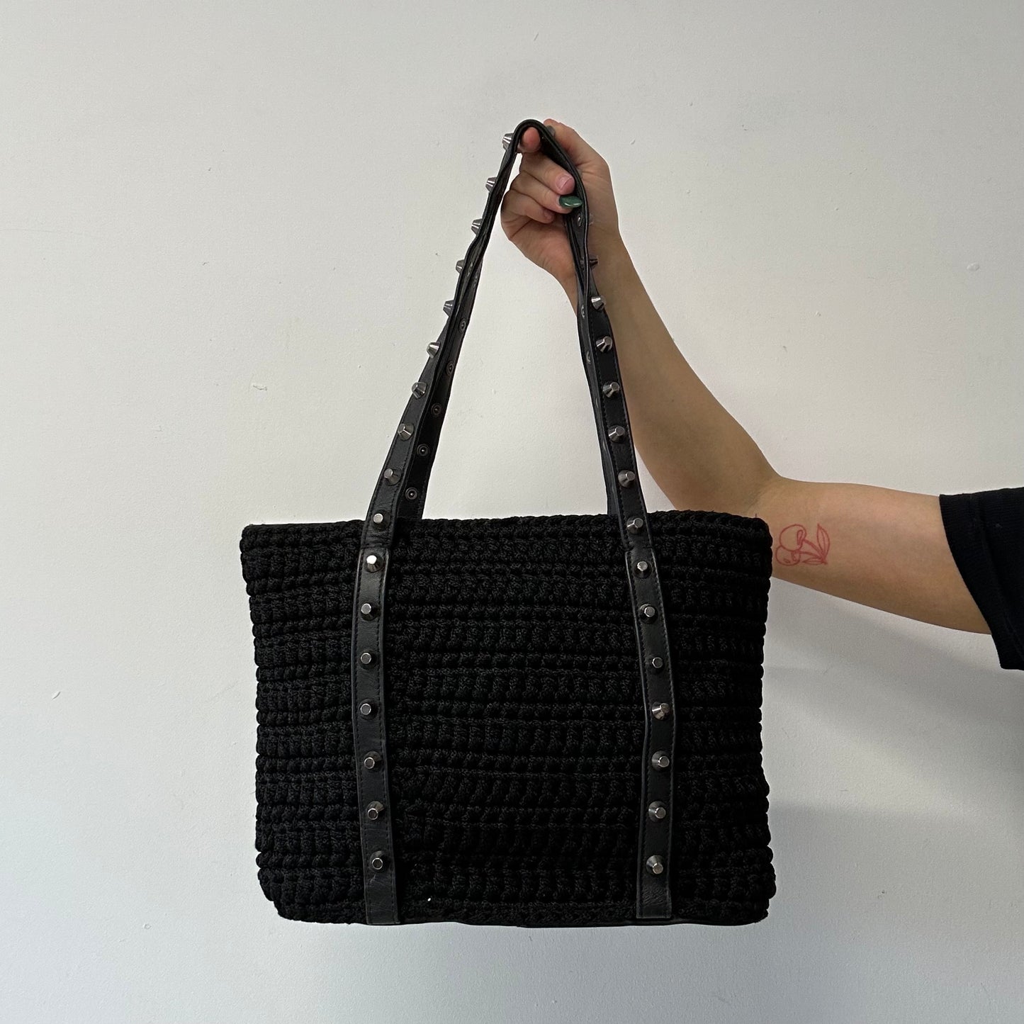 black woven studded shoulder bag