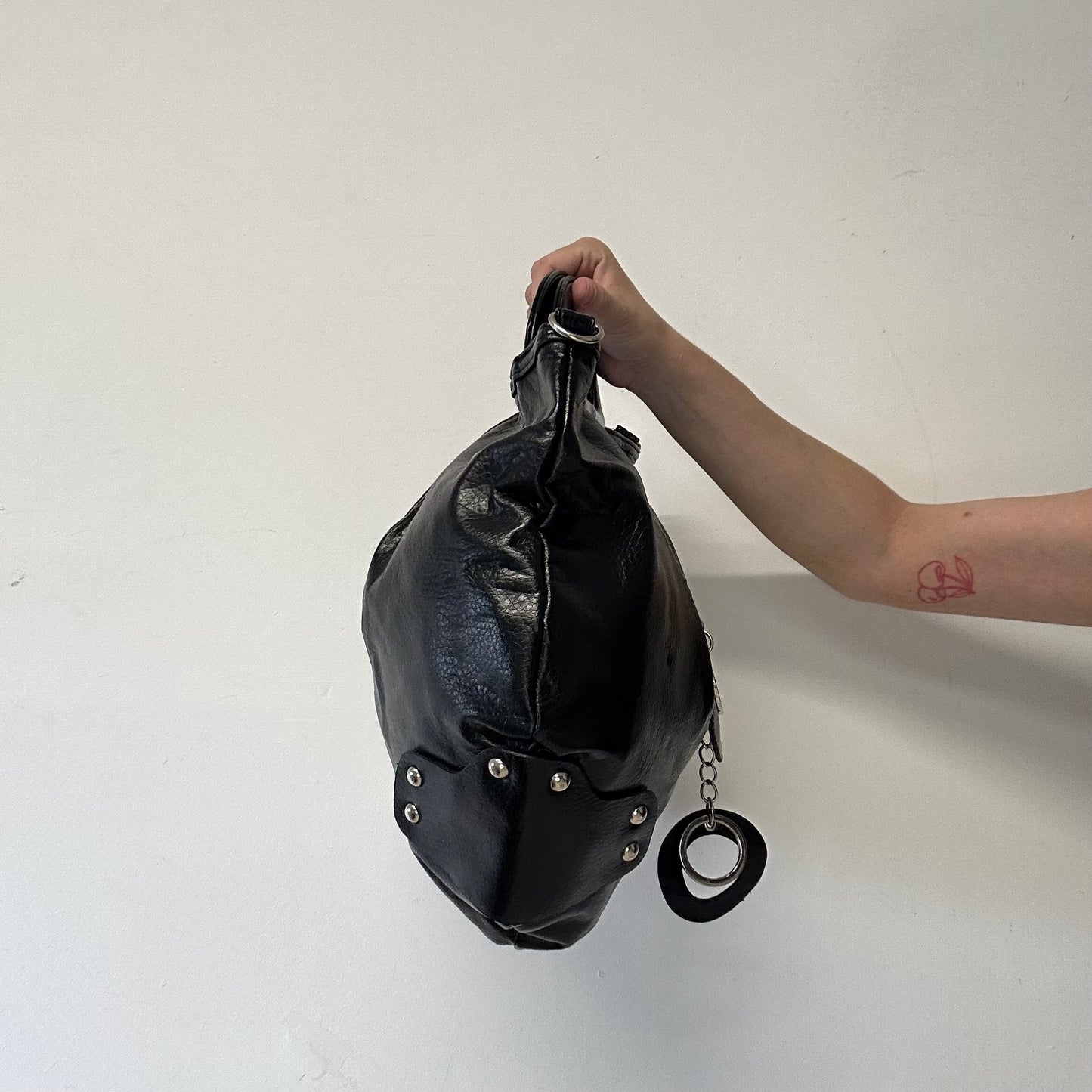 black faux leather keychain hand bag