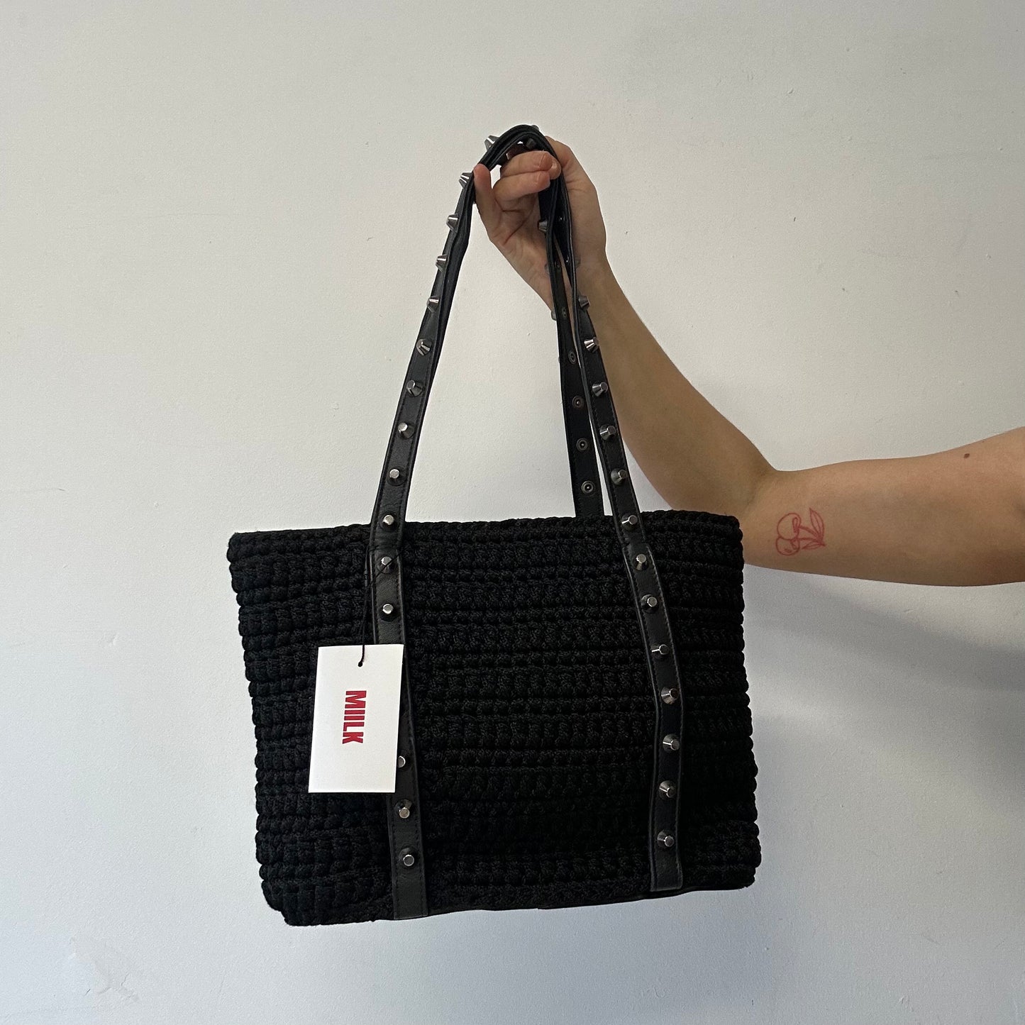black studded genuine leather woven shoulder bag