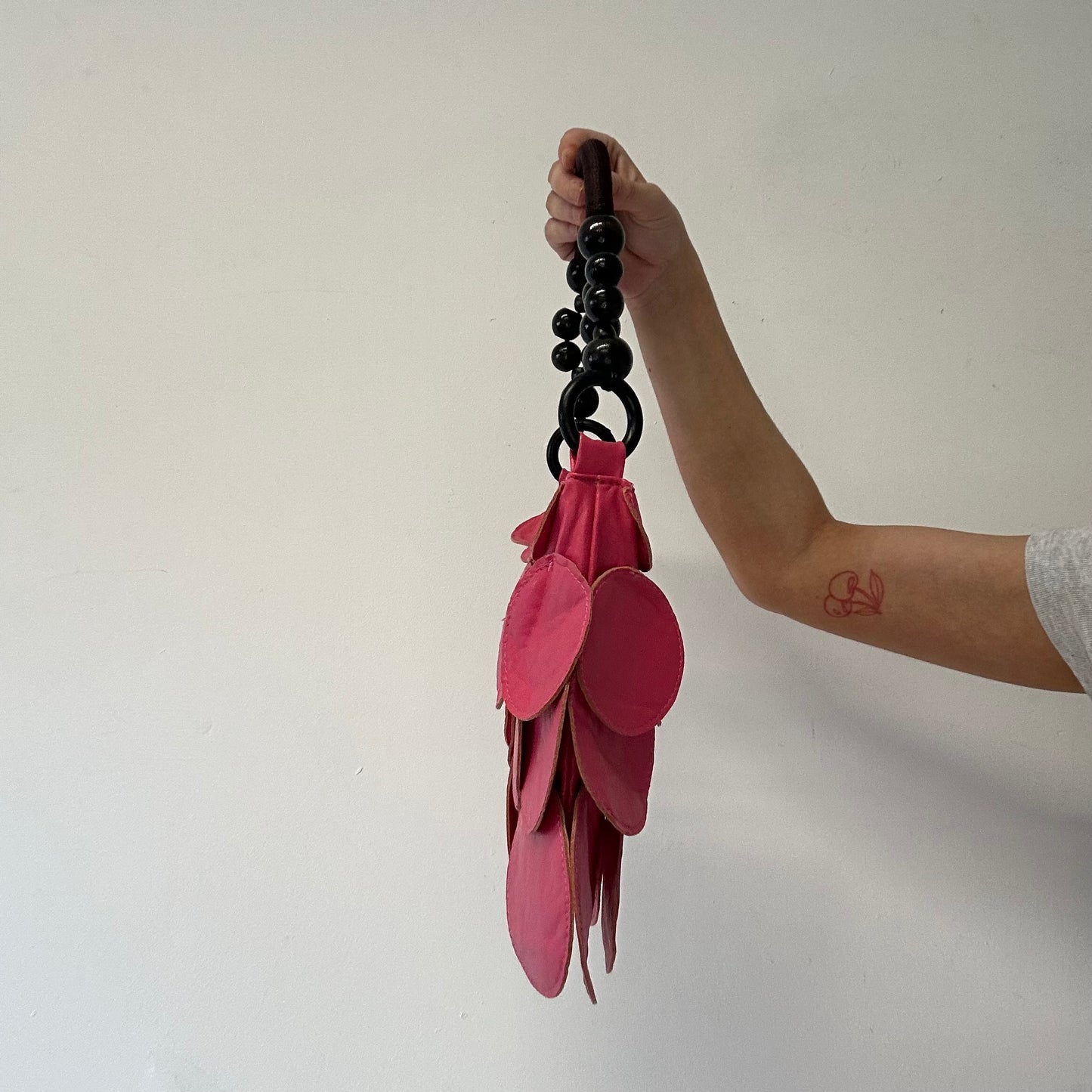 pink faux leather disc beaded shoulder bag