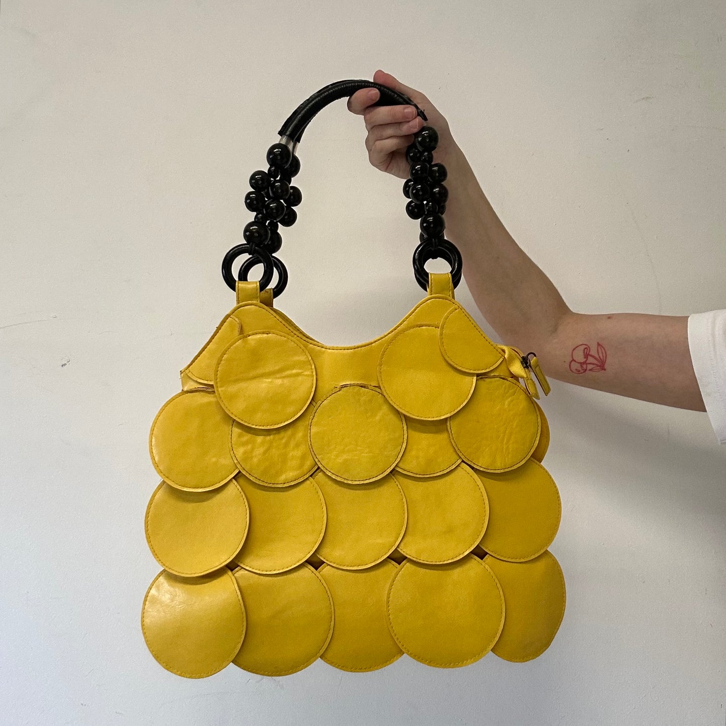 yellow faux leather disc beaded shoulder bag