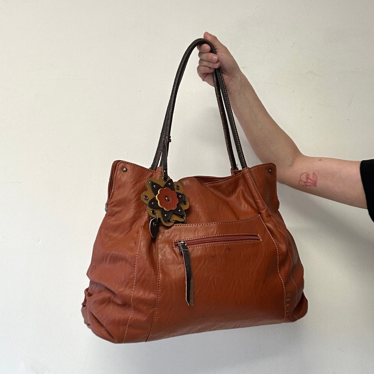 burnt orange brown faux leather flower detail shoulder bag