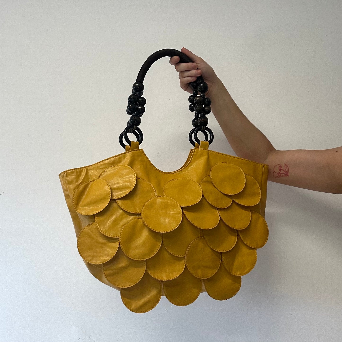 yellow faux leather disc beaded shoulder bag
