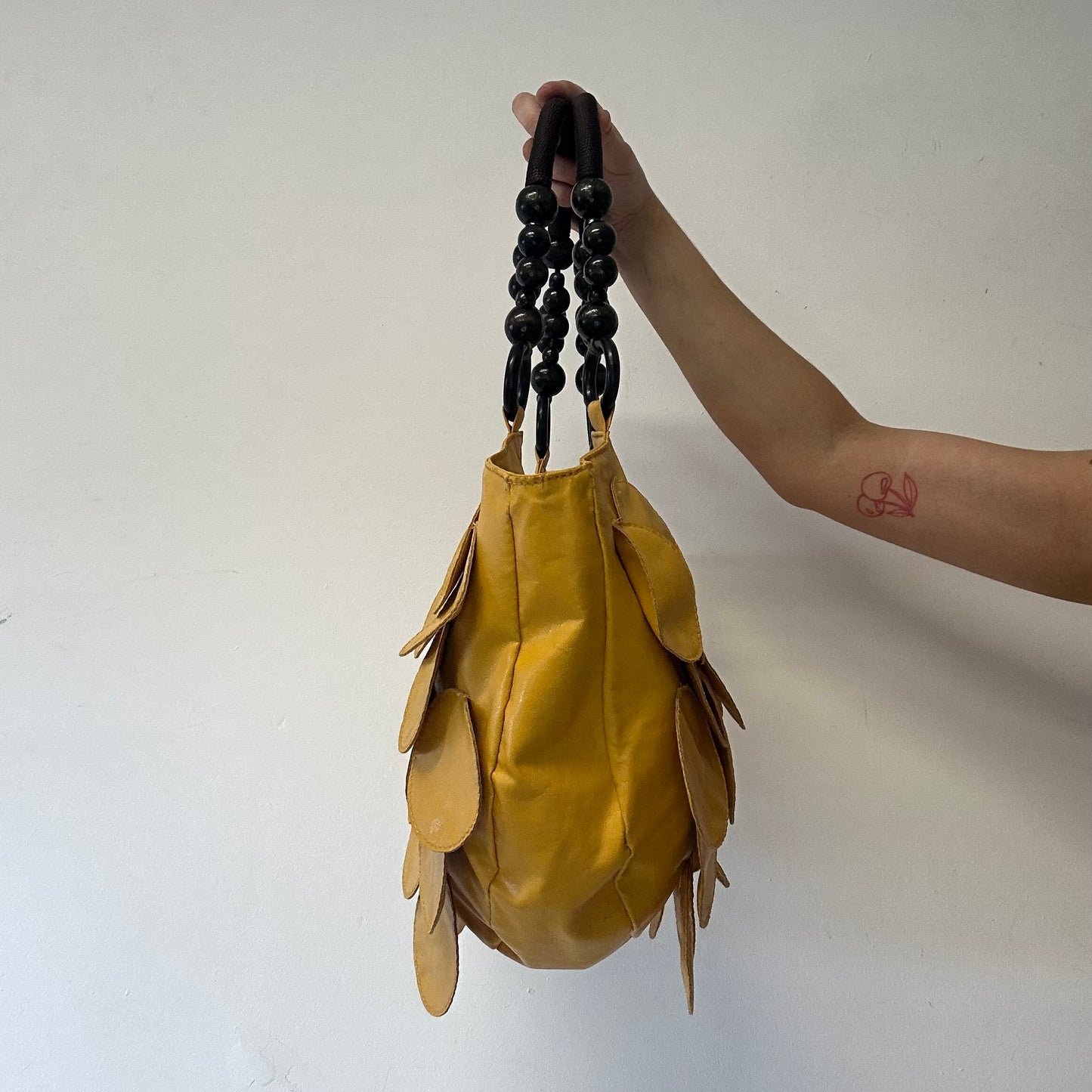yellow faux leather disc beaded shoulder bag