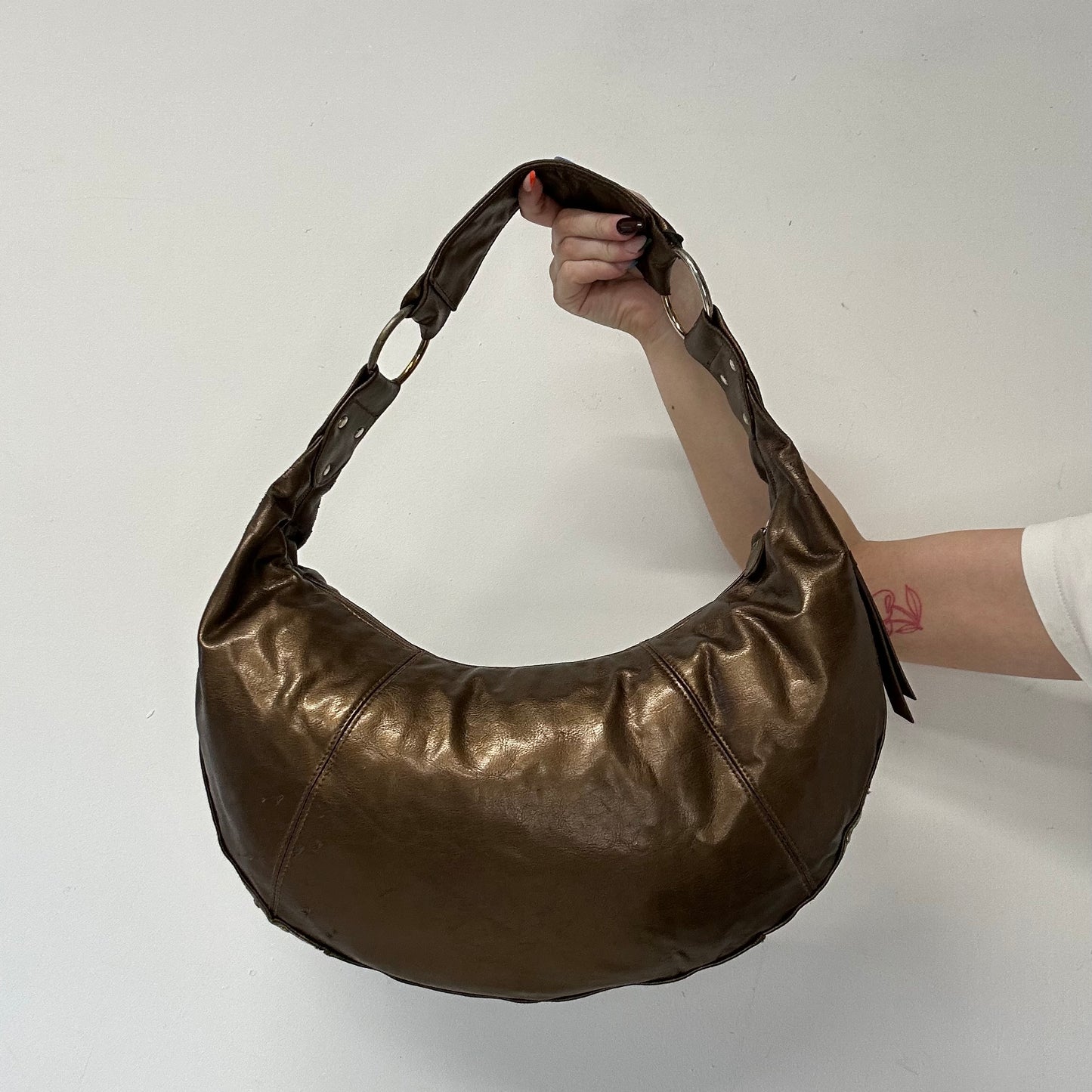 brown studded faux leather half crescent shoulder bag