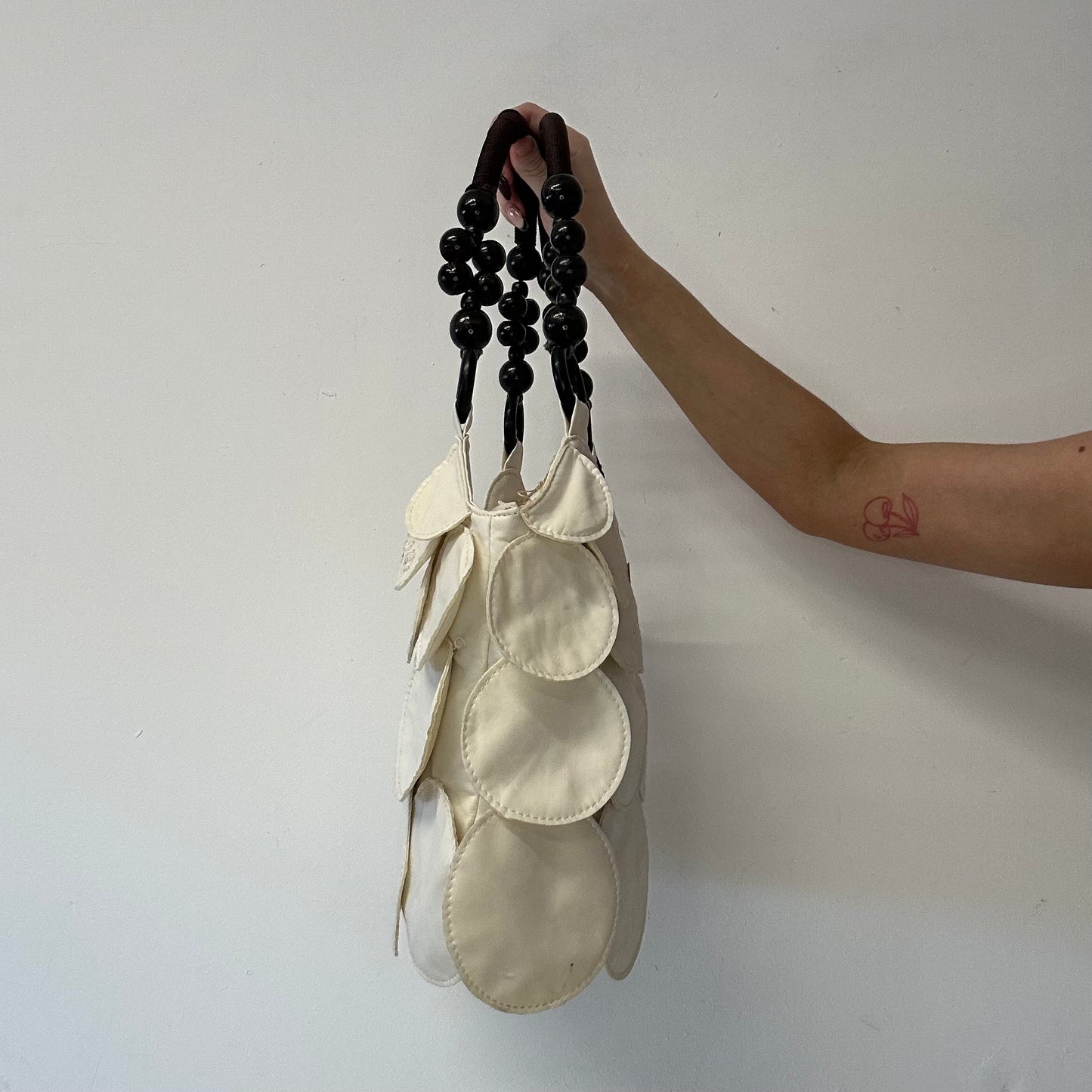 white faux leather disc beaded shoulder bag
