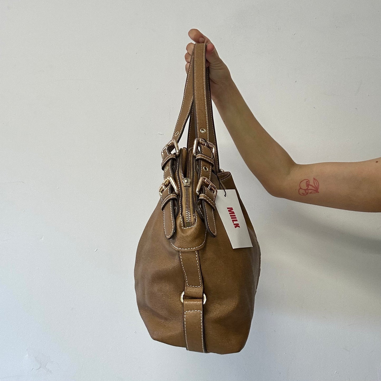 brown eyelet faux leather shoulder bag