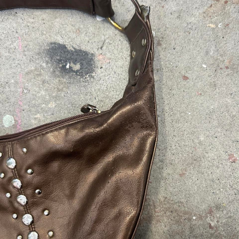 brown studded crescent faux leather shoulder bag