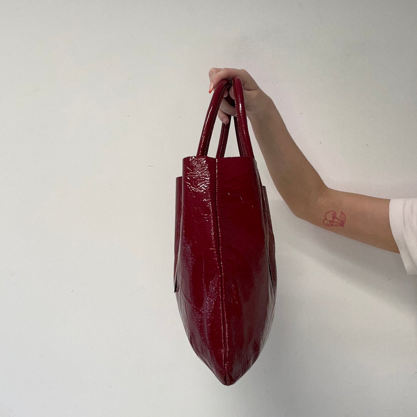 red lightweight patent shoulder bag