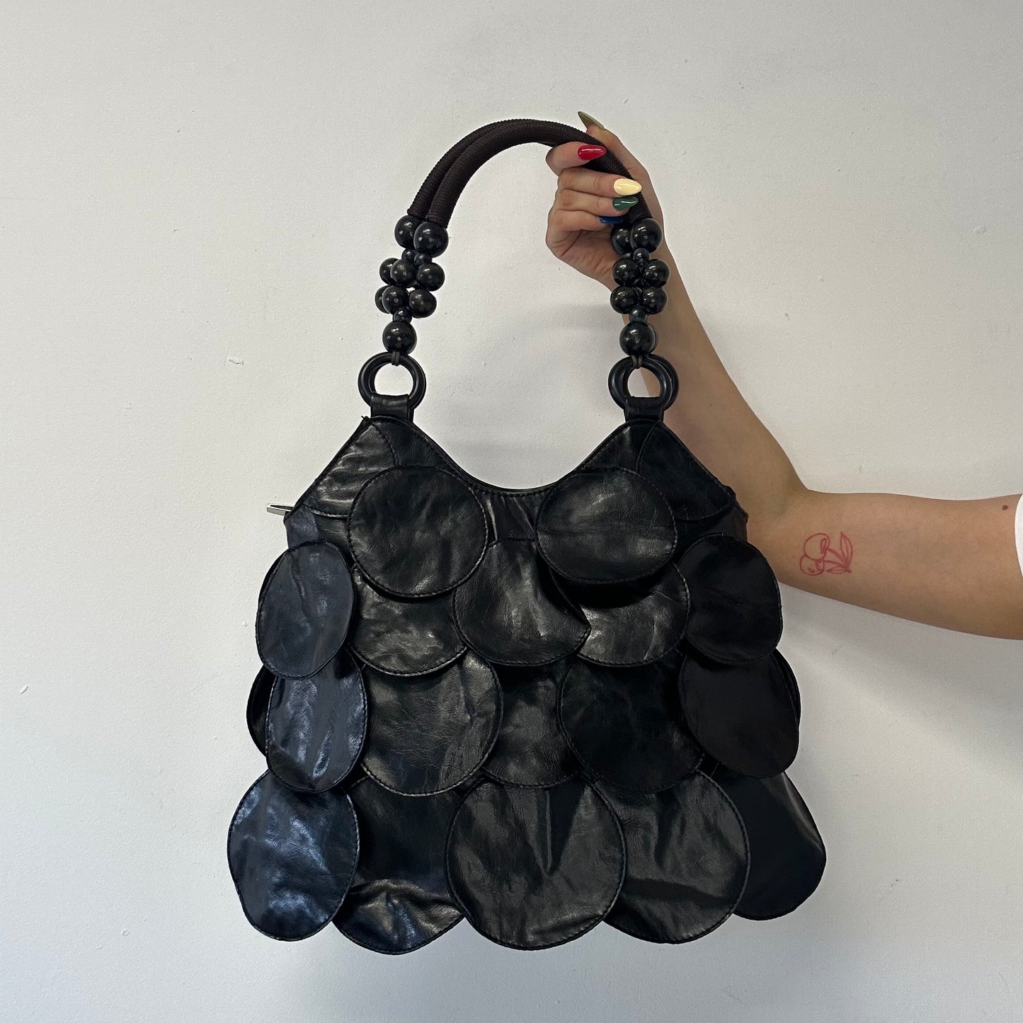 black faux leather disc beaded shoulder bag
