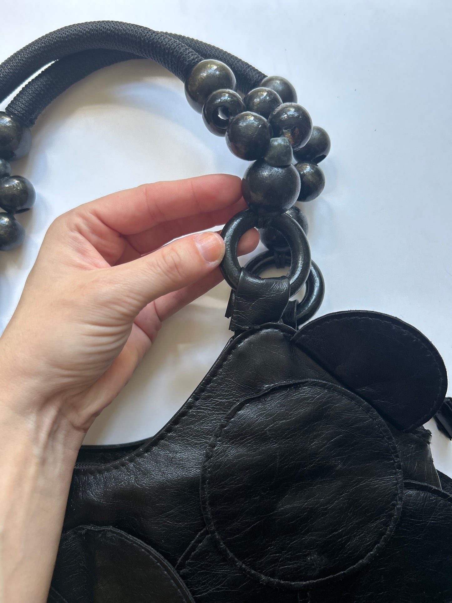 black faux leather disc beaded shoulder bag