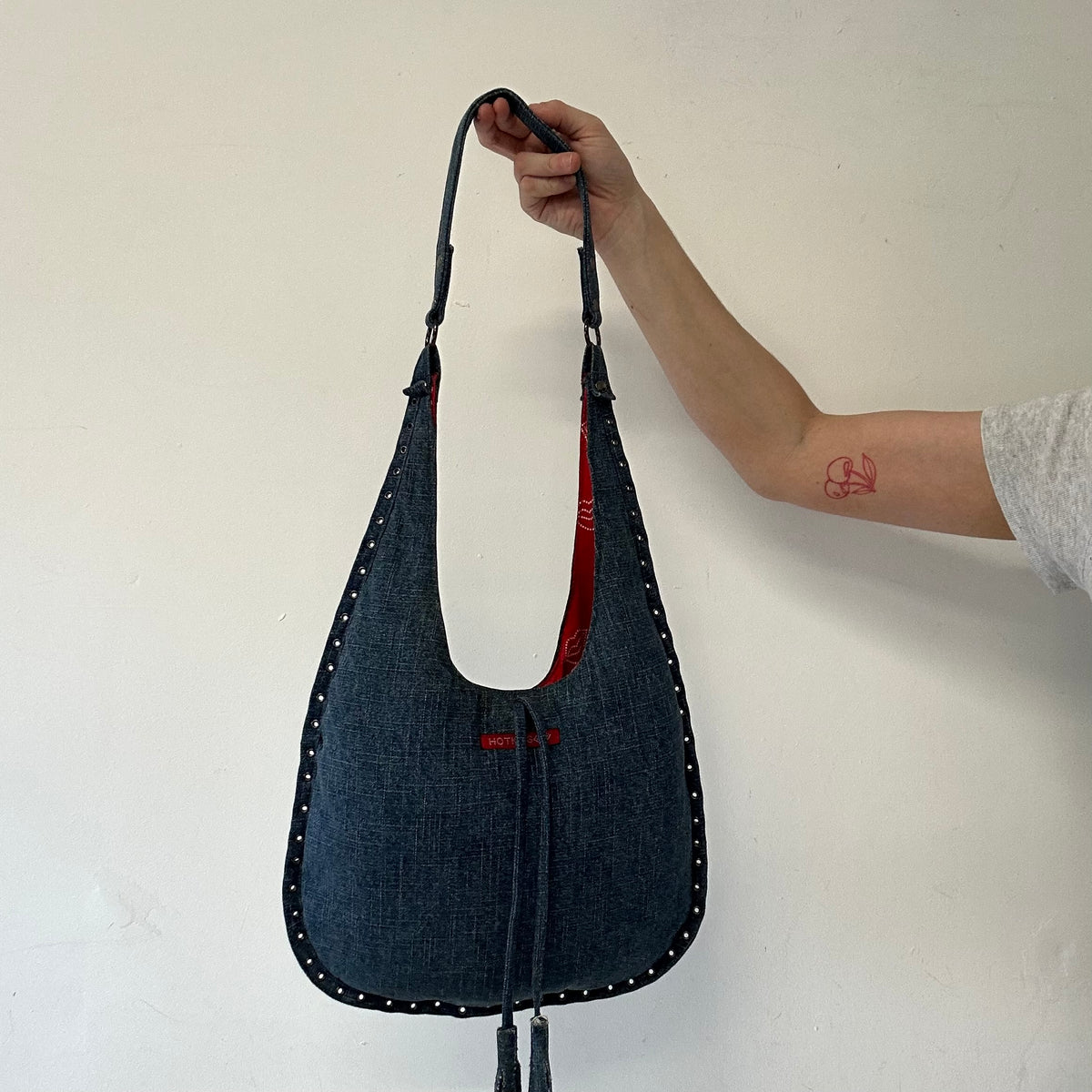 blue denim eyelet shoulder bag