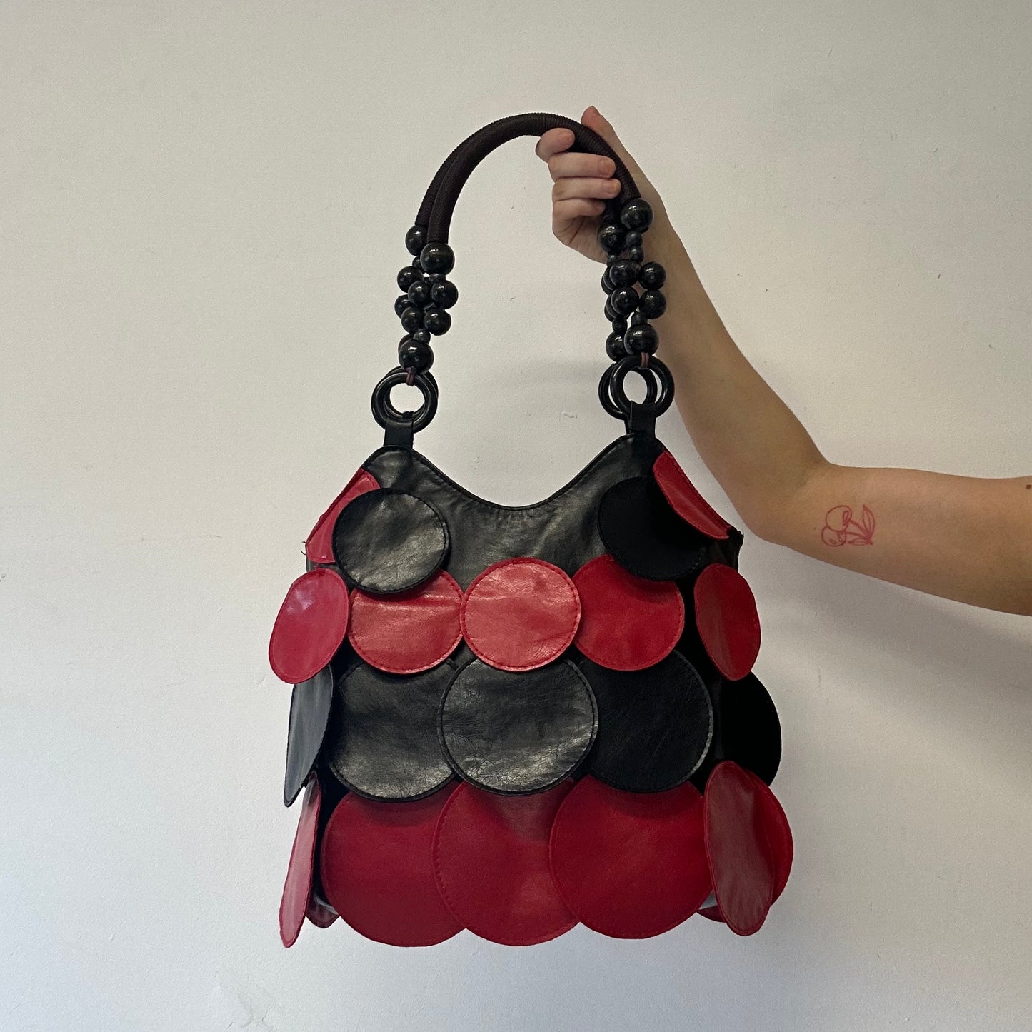 black and red faux leather disc beaded shoulder bag